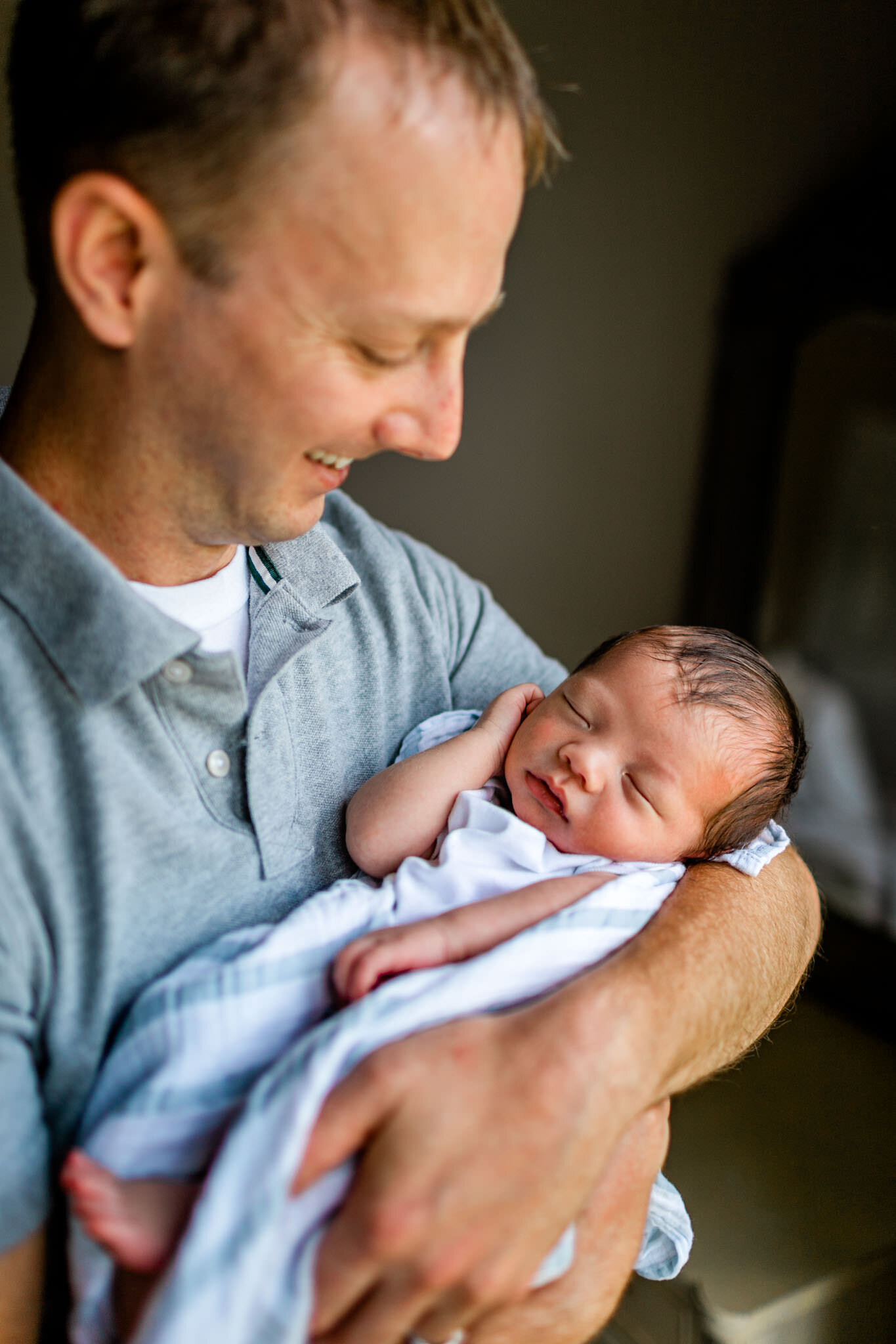 Father looking at baby boy | Durham Newborn Photographer | By G. Lin Photography