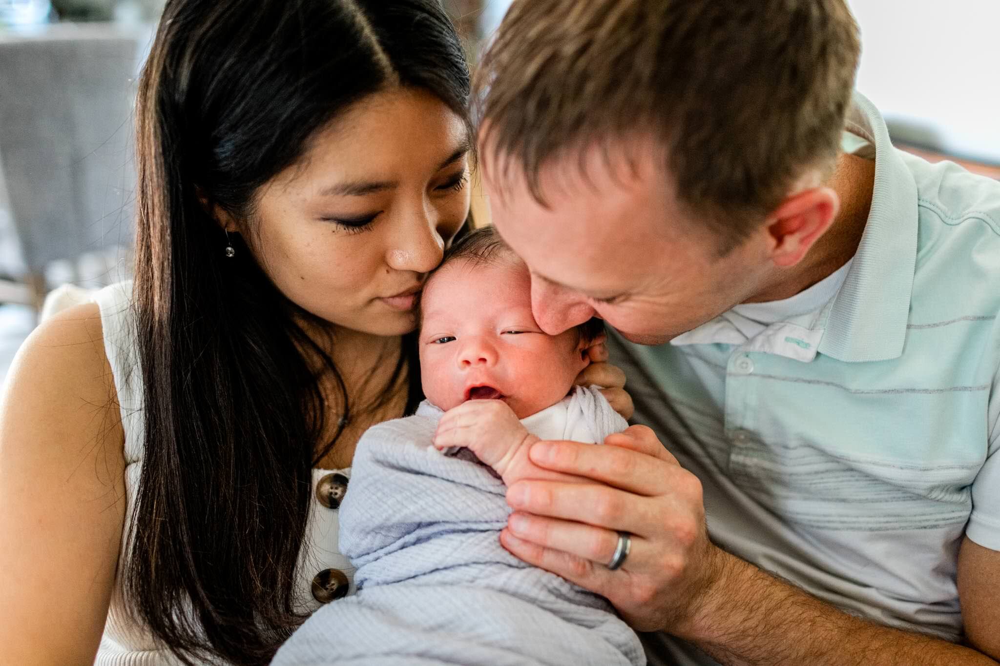 Parents kissing baby | Durham Newborn Photographer | By G. Lin Photography