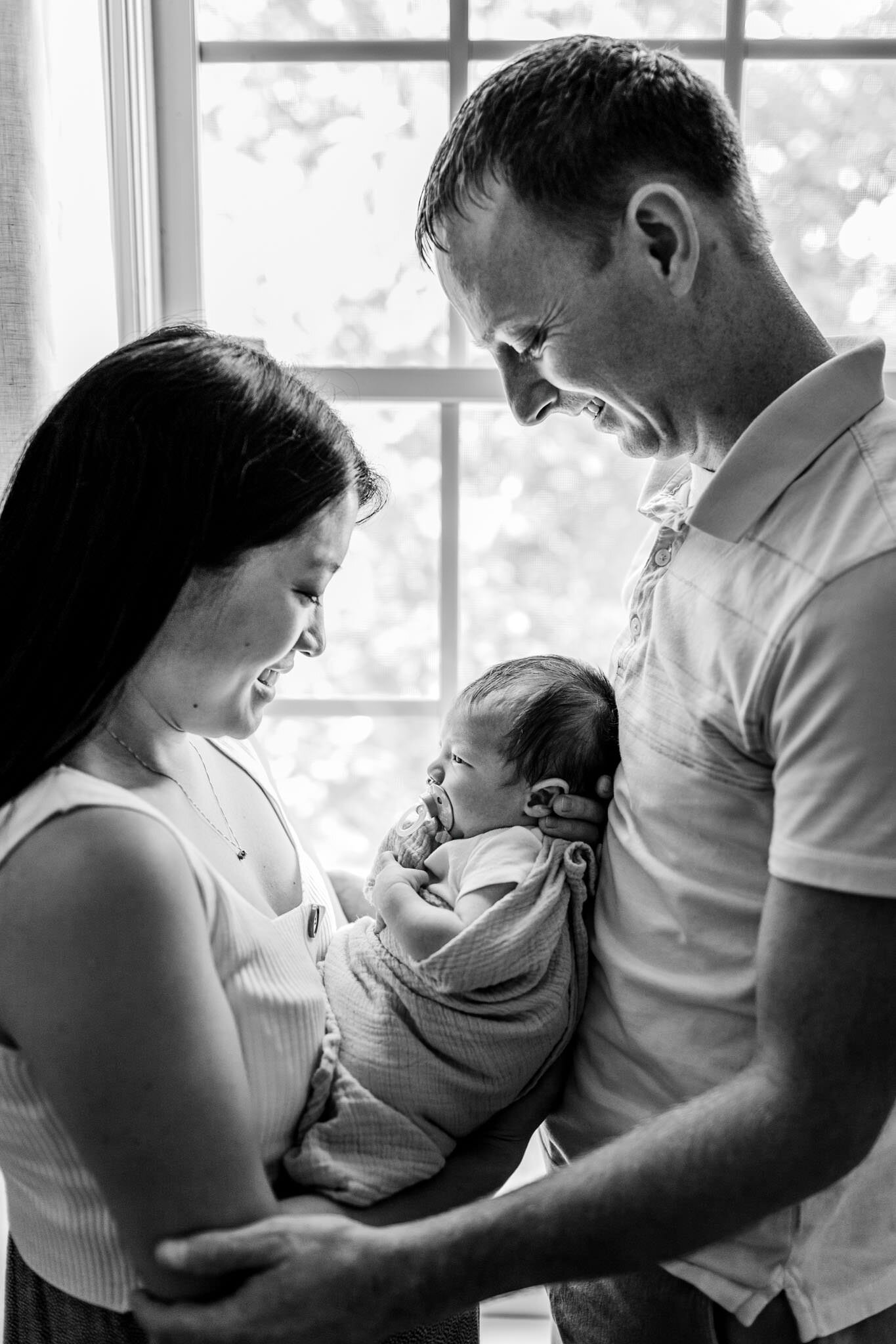 Beautiful black and white photo of parents holding baby | Durham Newborn Photographer | By G. Lin Photography