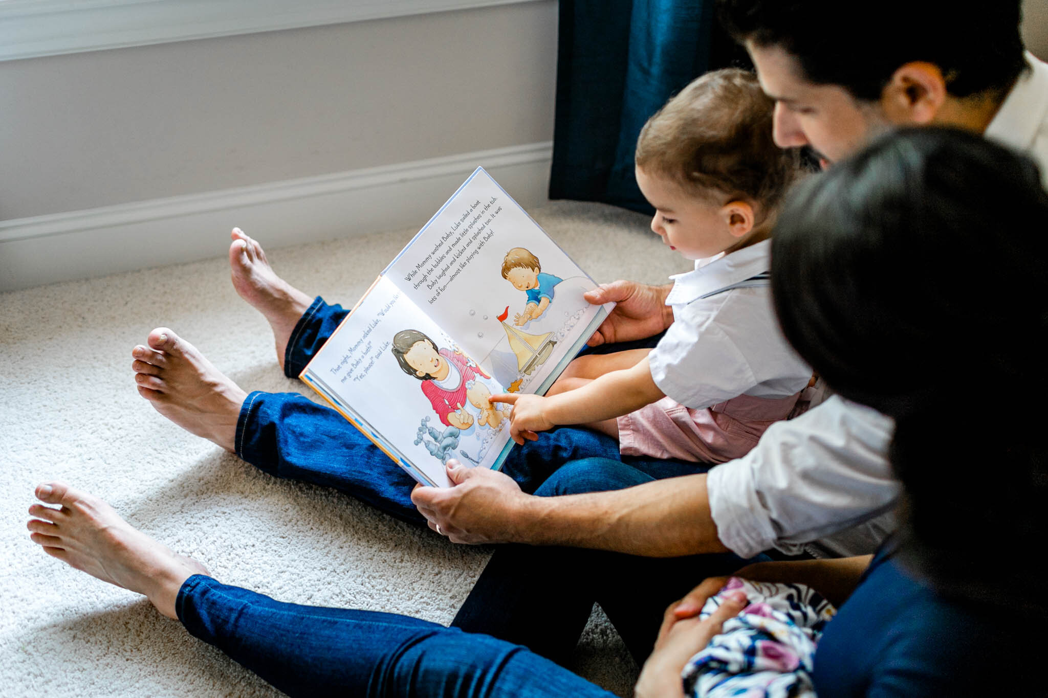 Little boy reading book with parents | Durham Newborn Photographer | By G. Lin Photography