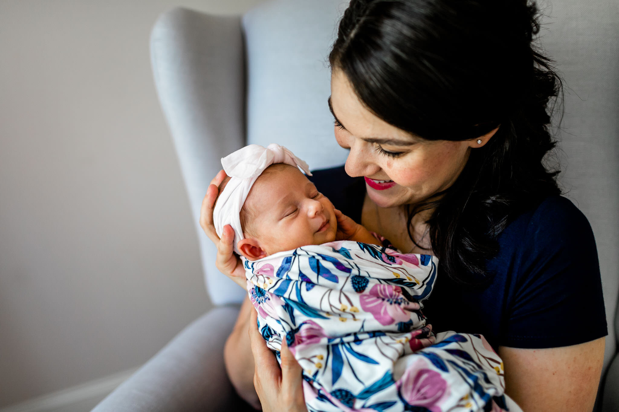 Beautiful lifestyle newborn photo at home | Mother cradling baby girl | Durham Newborn Photographer | By G. Lin Photography