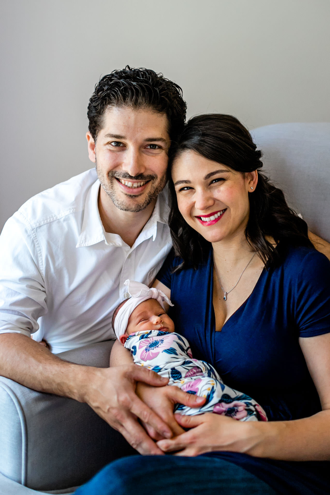 Beautiful portrait of parents holding baby girl at home | Durham Newborn Photographer | By G. Lin Photography