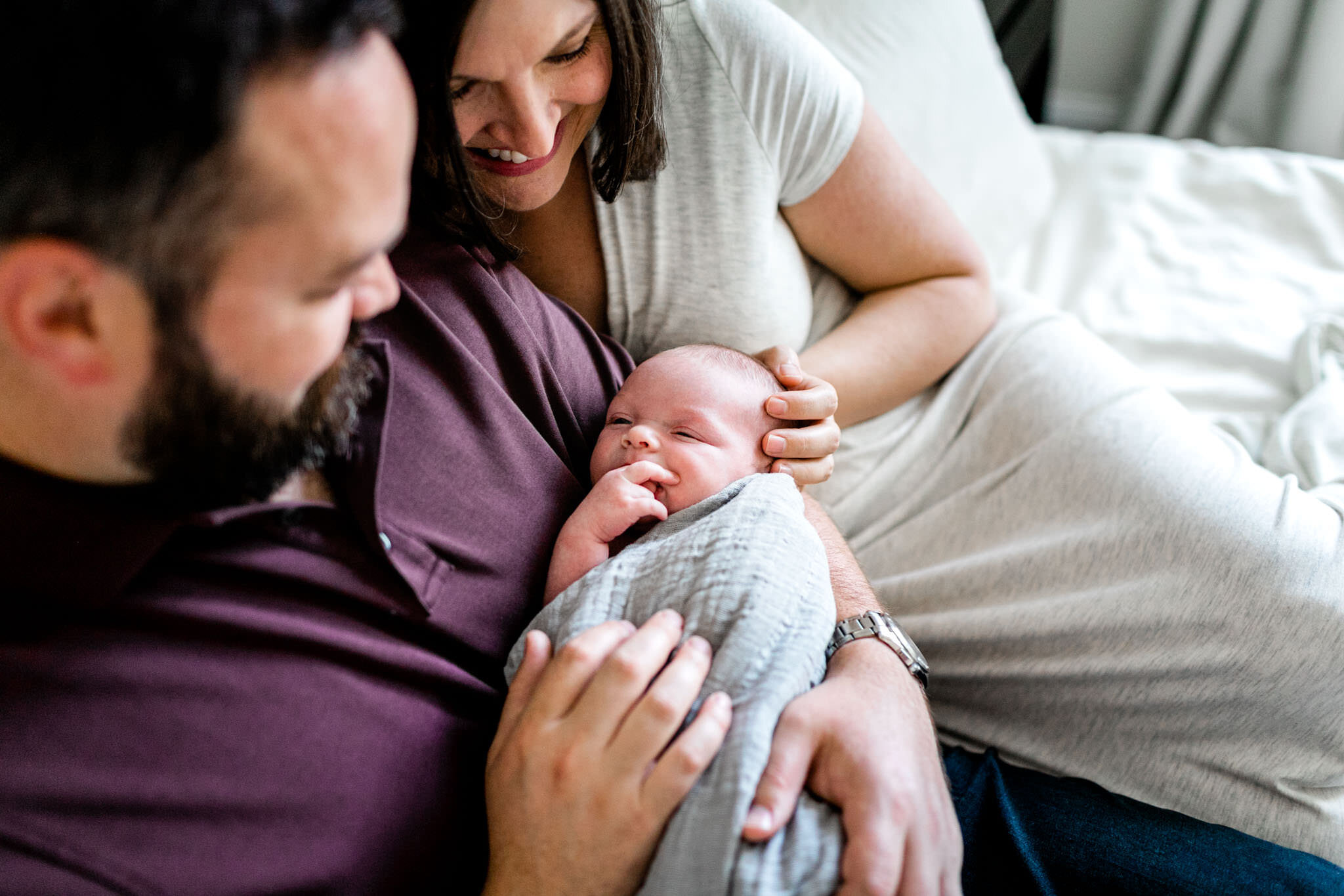 Parents holding baby in their arms at home | Durham Newborn Photographer | By G. Lin Photography