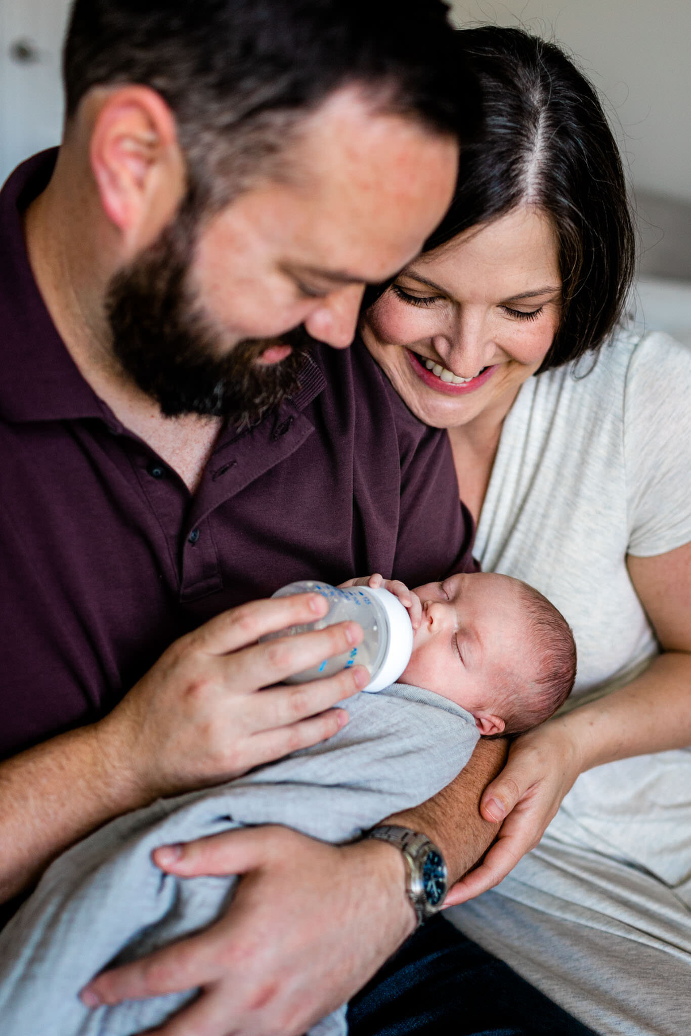 Parents smiling at baby girl | Durham Newborn Photographer | By G. Lin Photography | Lifestyle Family Session at Home
