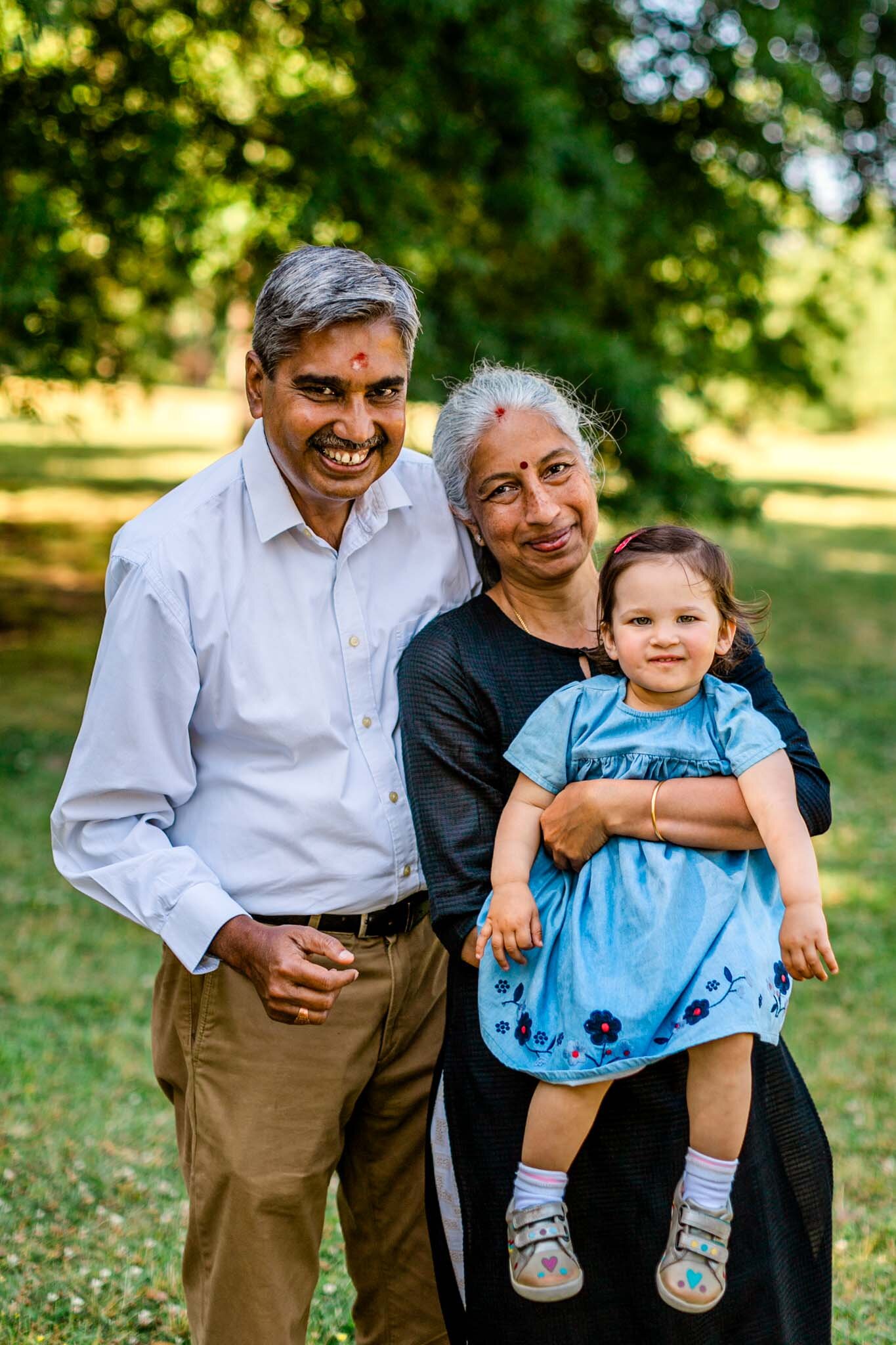Forest Hills Park | Durham Family Photographer | By G. Lin Photography | Grandparents holding baby granddaughter