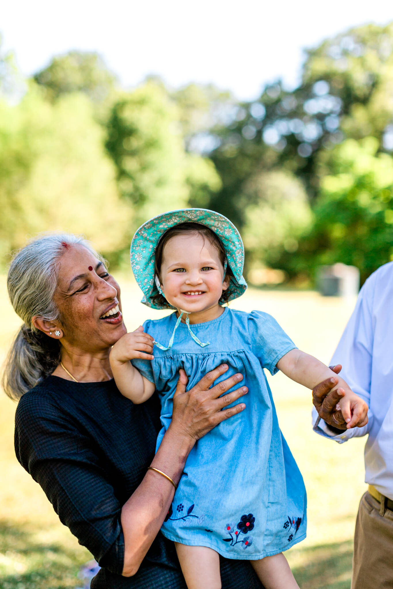 Forest Hills Park | Durham Family Photographer | By G. Lin Photography | Grandmother holding and laughing with grandchild