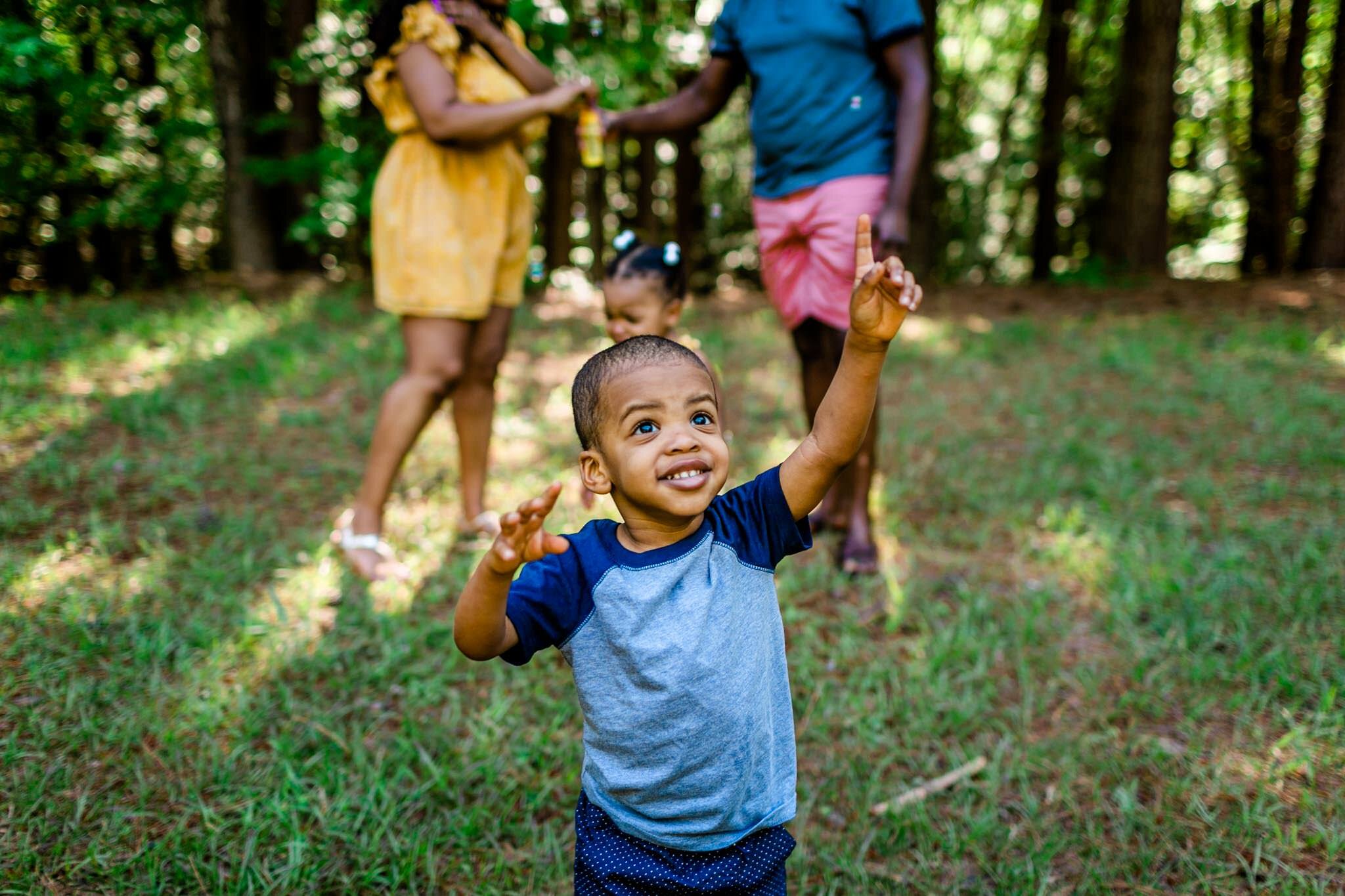 Young boy smiling | Raleigh Family Photographer | By G. Lin Photography | Umstead Park