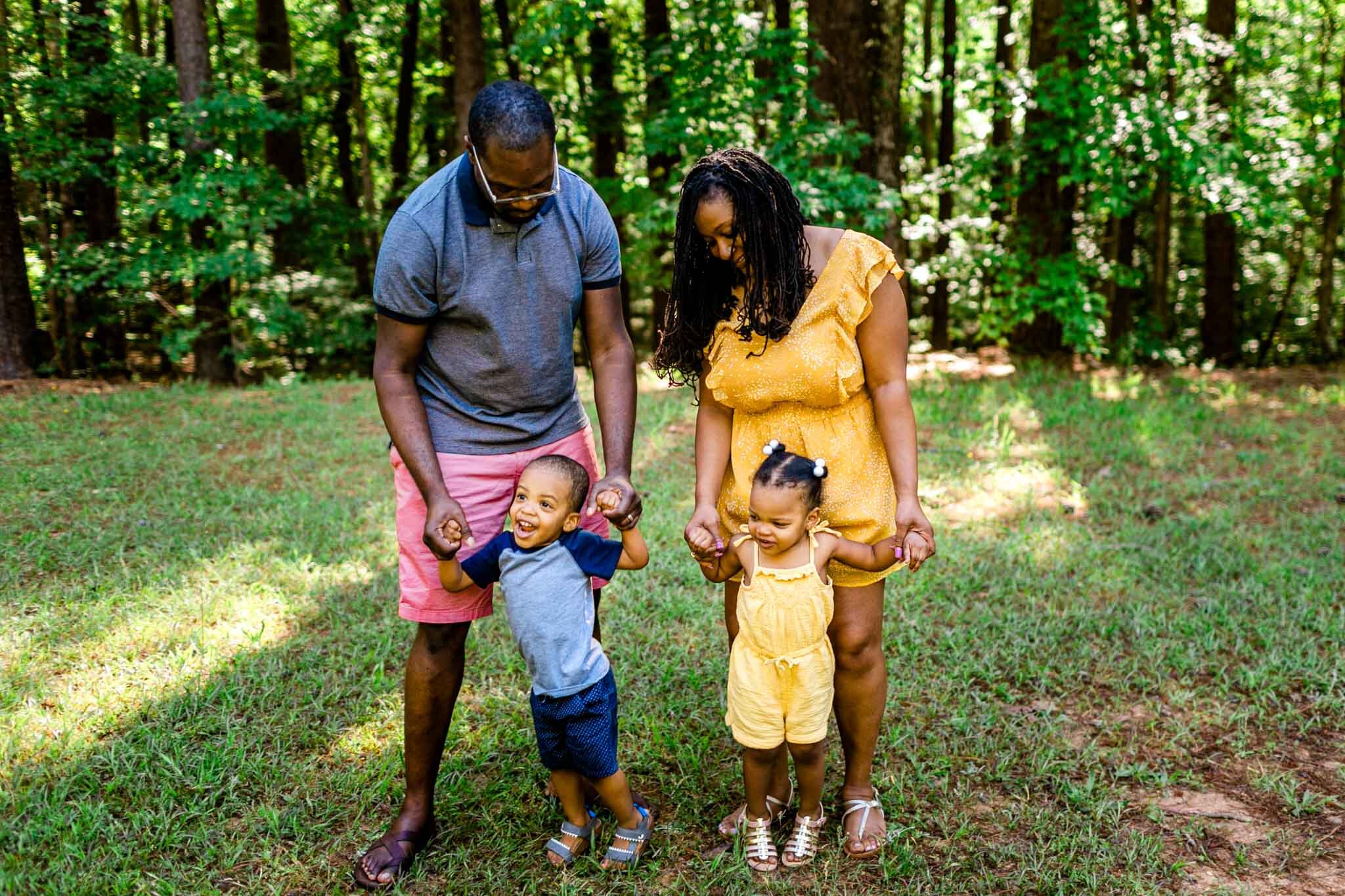 Raleigh Family Photographer | By G. Lin Photography | Umstead Park | Parents with children holding hands