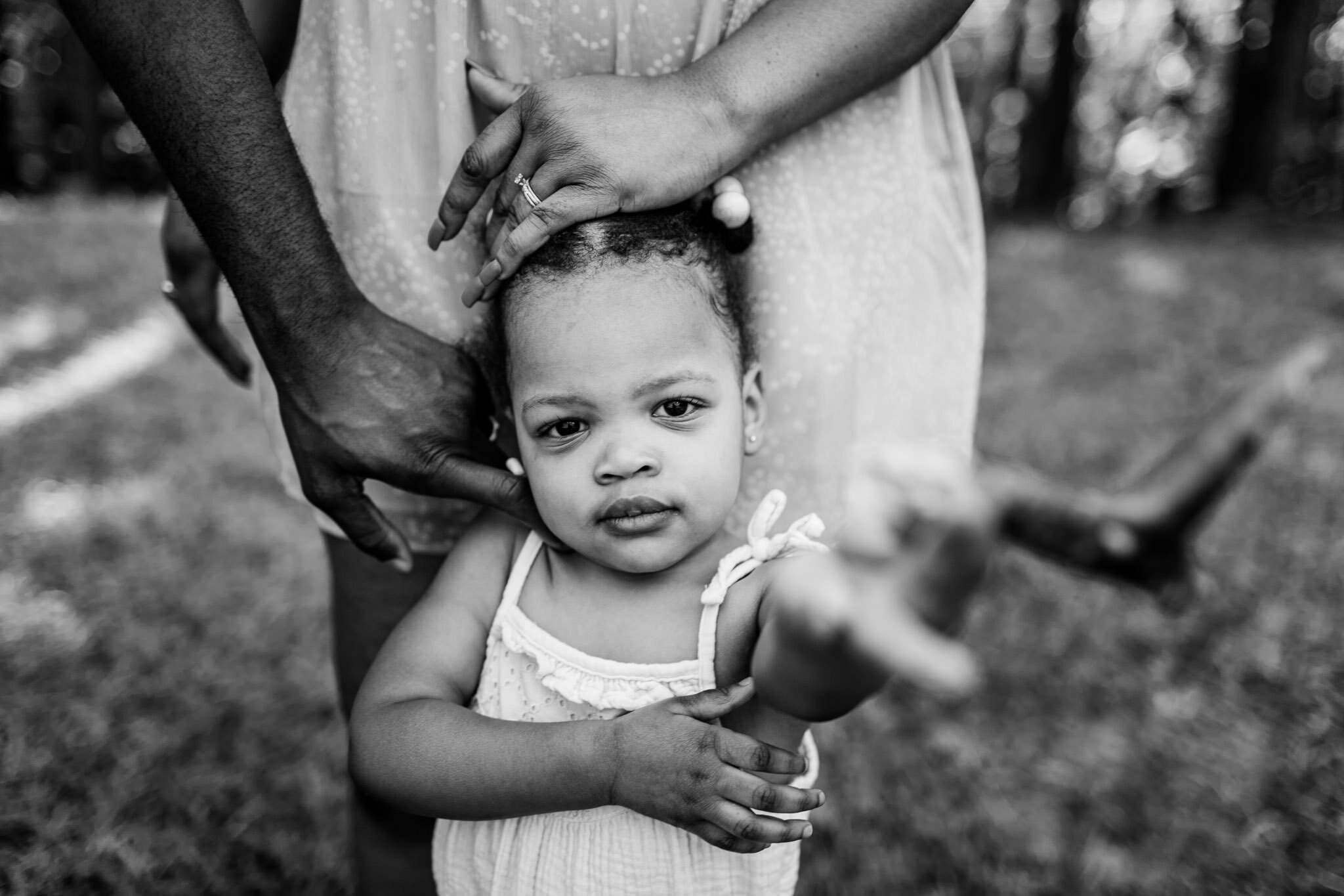 LIttle girl looking at camera | Raleigh Family Photographer | By G. Lin Photography | Umstead Park