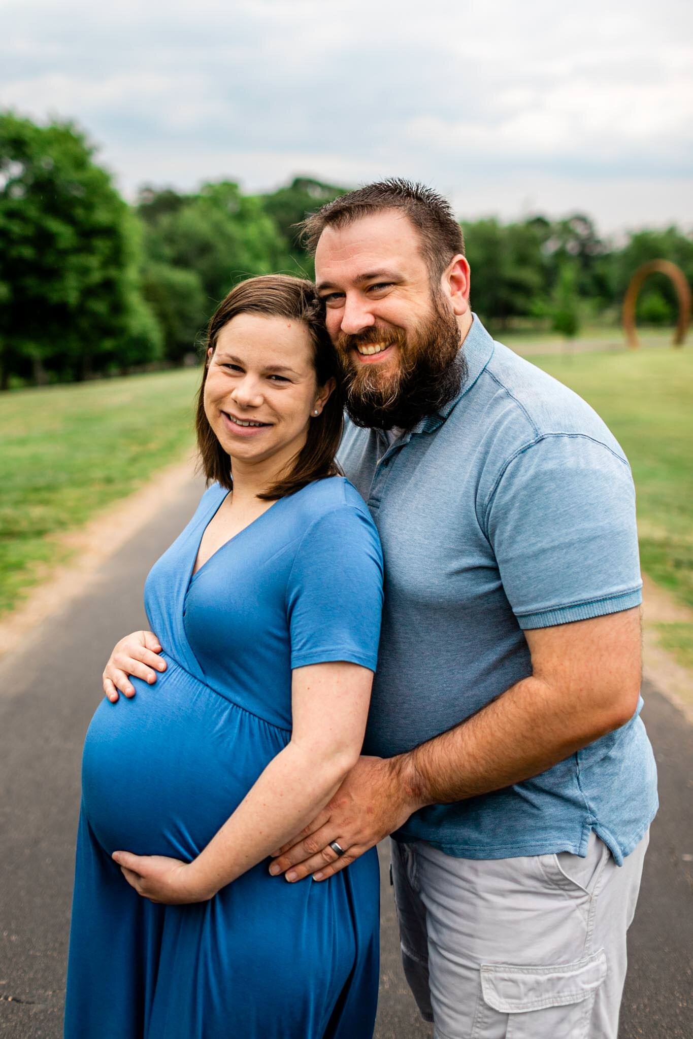 Couple smiling at camera | Spring Maternity Session at NCMA | Raleigh Maternity Photographer | By G. Lin Photography