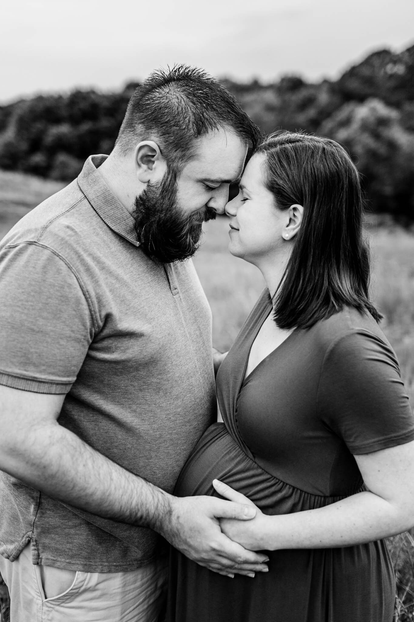 NCMA Maternity Photos | Raleigh Maternity Photographer | By G. Lin Photography | Black and white image of husband and wife embracing baby bump