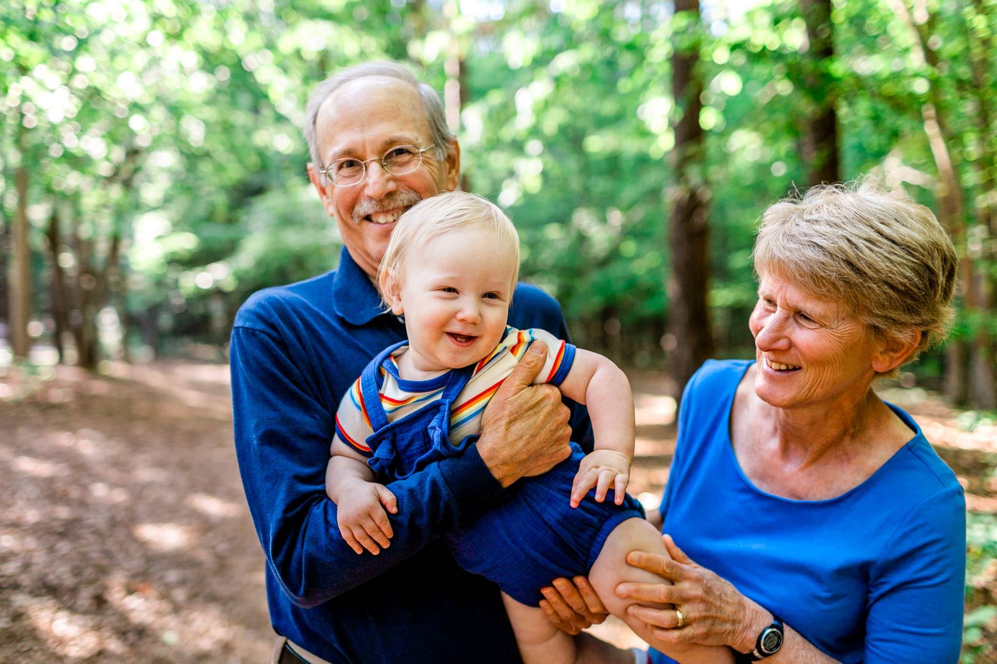 Grandparents holding baby boy | Raleigh Family Photographer | Umstead Park | By G. Lin Photography
