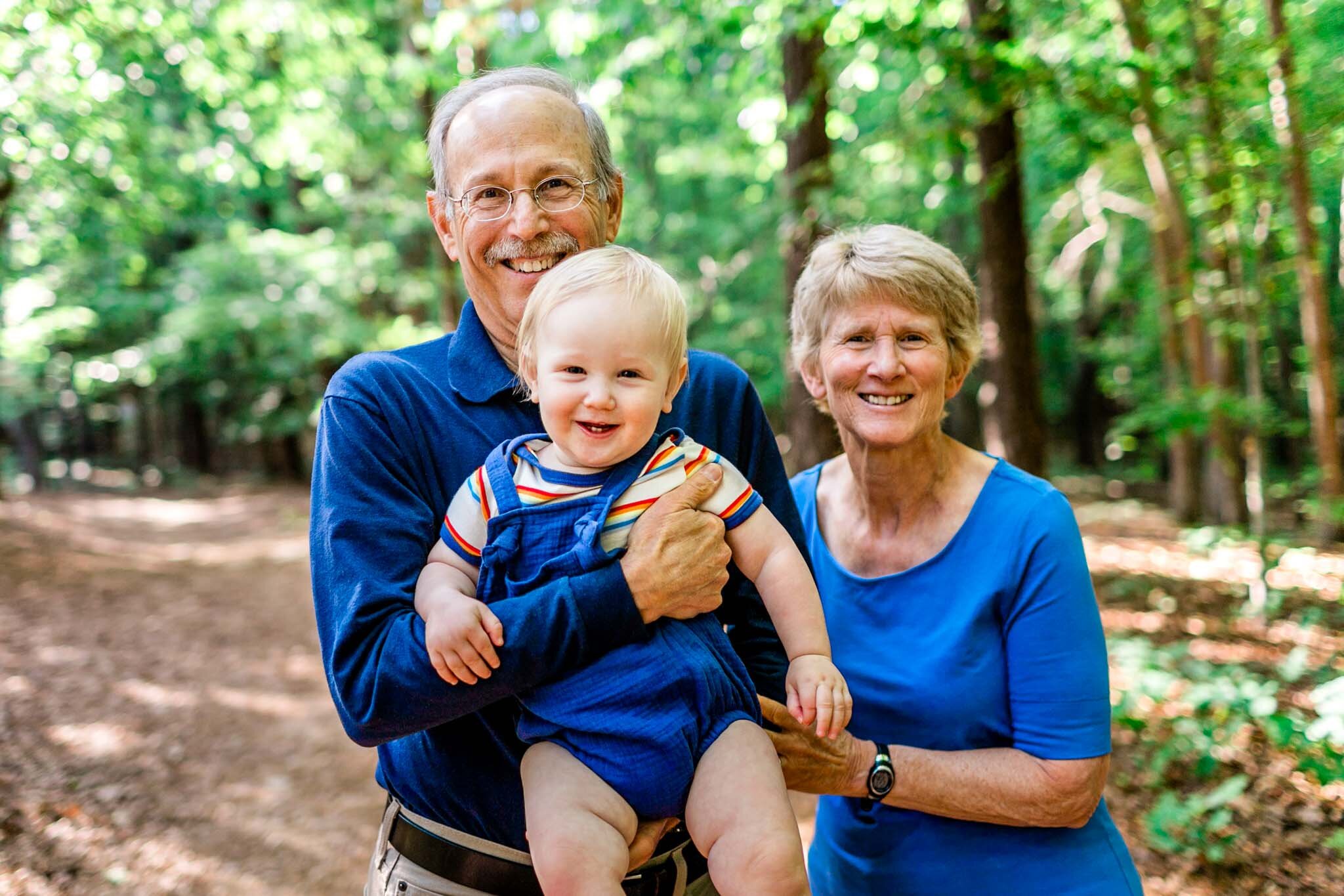 Raleigh Family Photographer | Umstead Park | By G. Lin Photography | Grandparents holding grandson