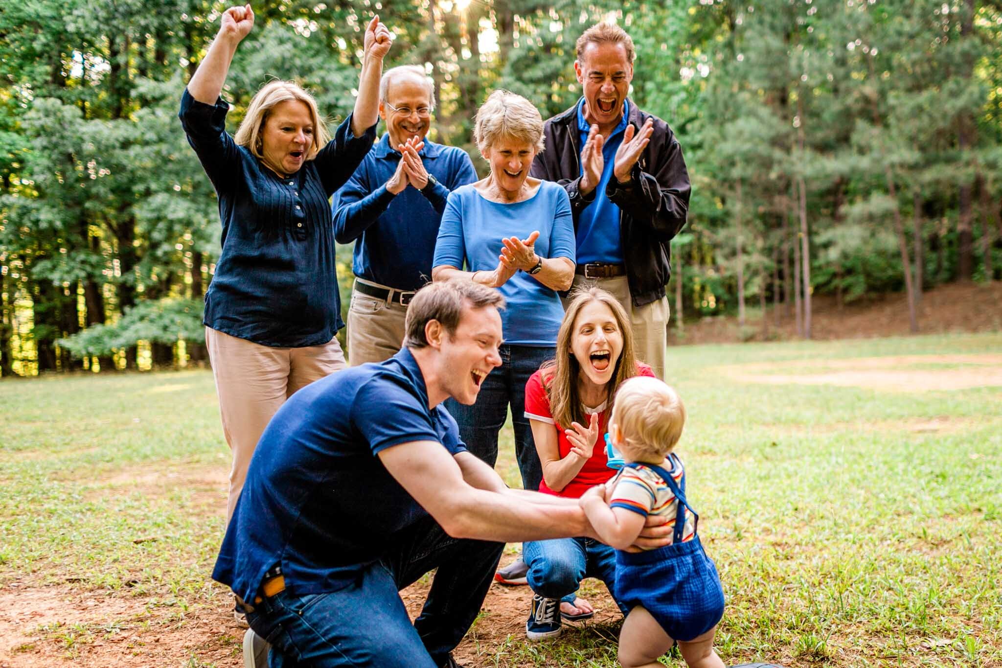 Family cheering on baby | Raleigh Family Photographer | Umstead Park | By G. Lin Photography