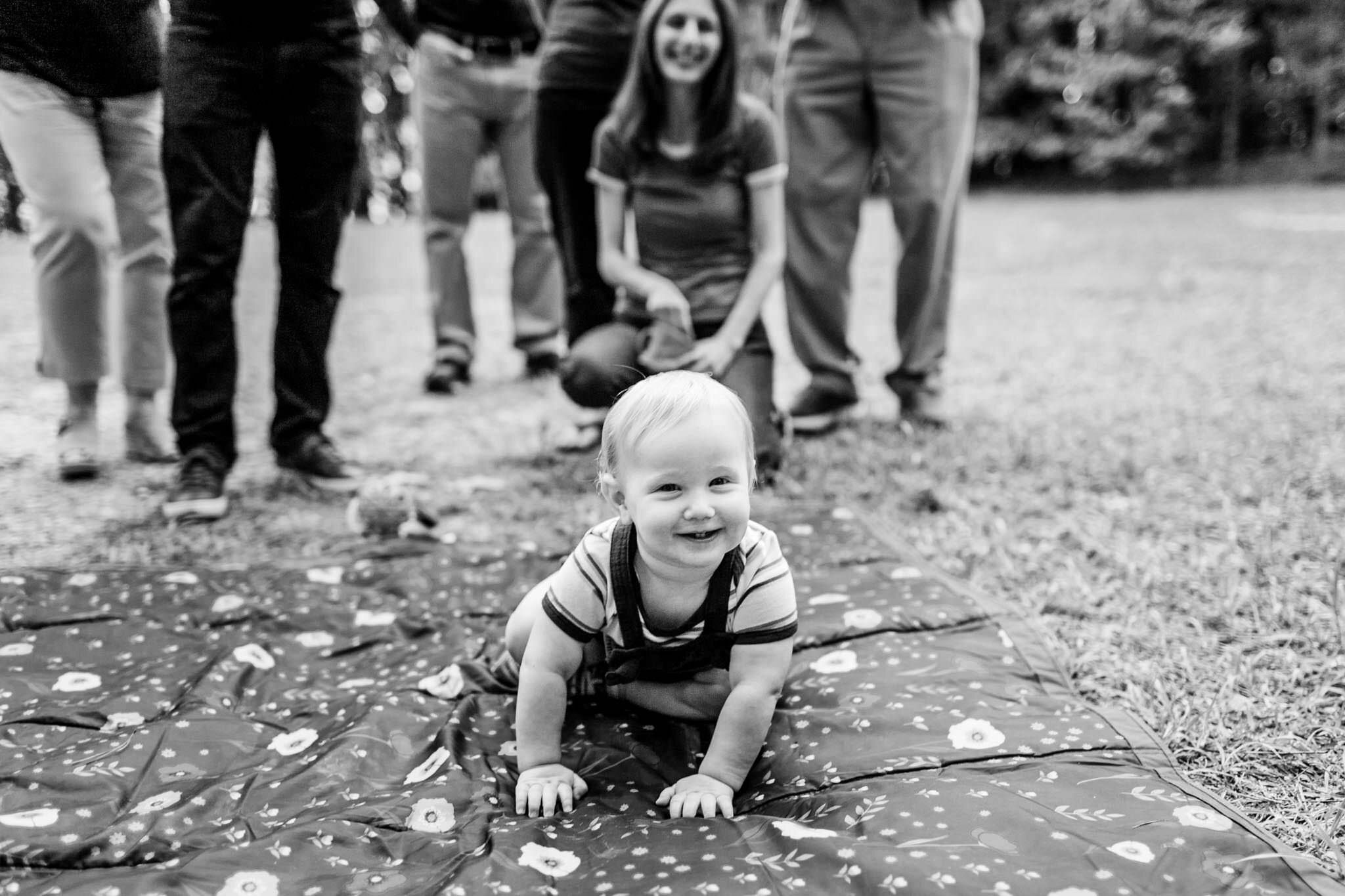 Baby boy crawling on blanket outside | Raleigh Family Photographer | Umstead Park | By G. Lin Photography