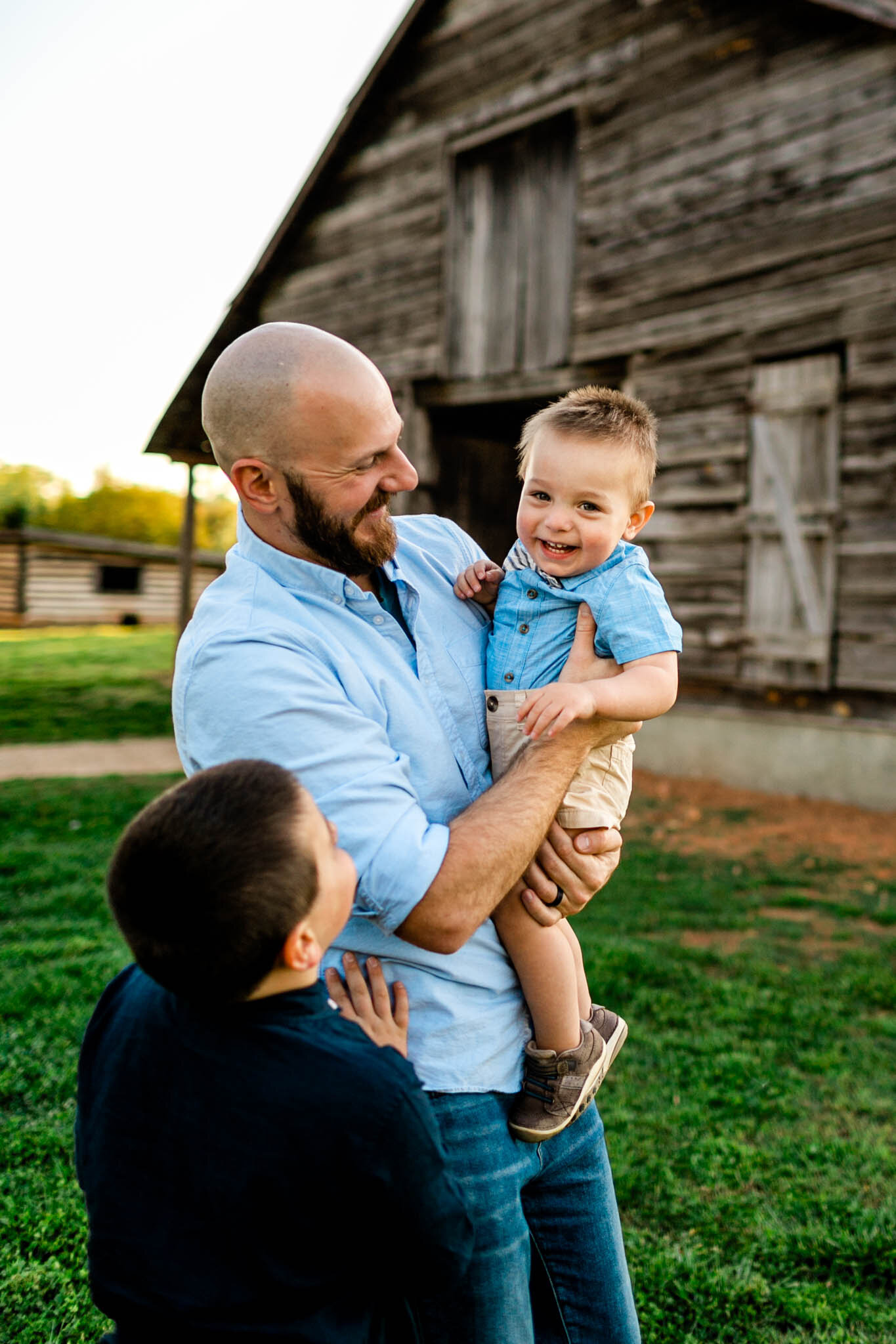 Father holding son | Raleigh Family Photographer | Joyner Park | By G. Lin Photography