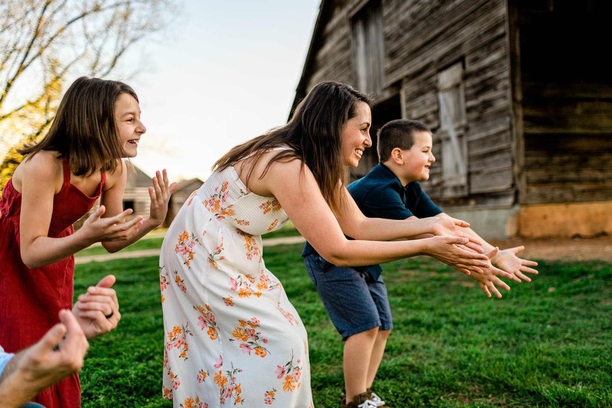 Candid family photo of mom and kids cheering | Raleigh Family Photographer | Joyner Park | By G. Lin Photography