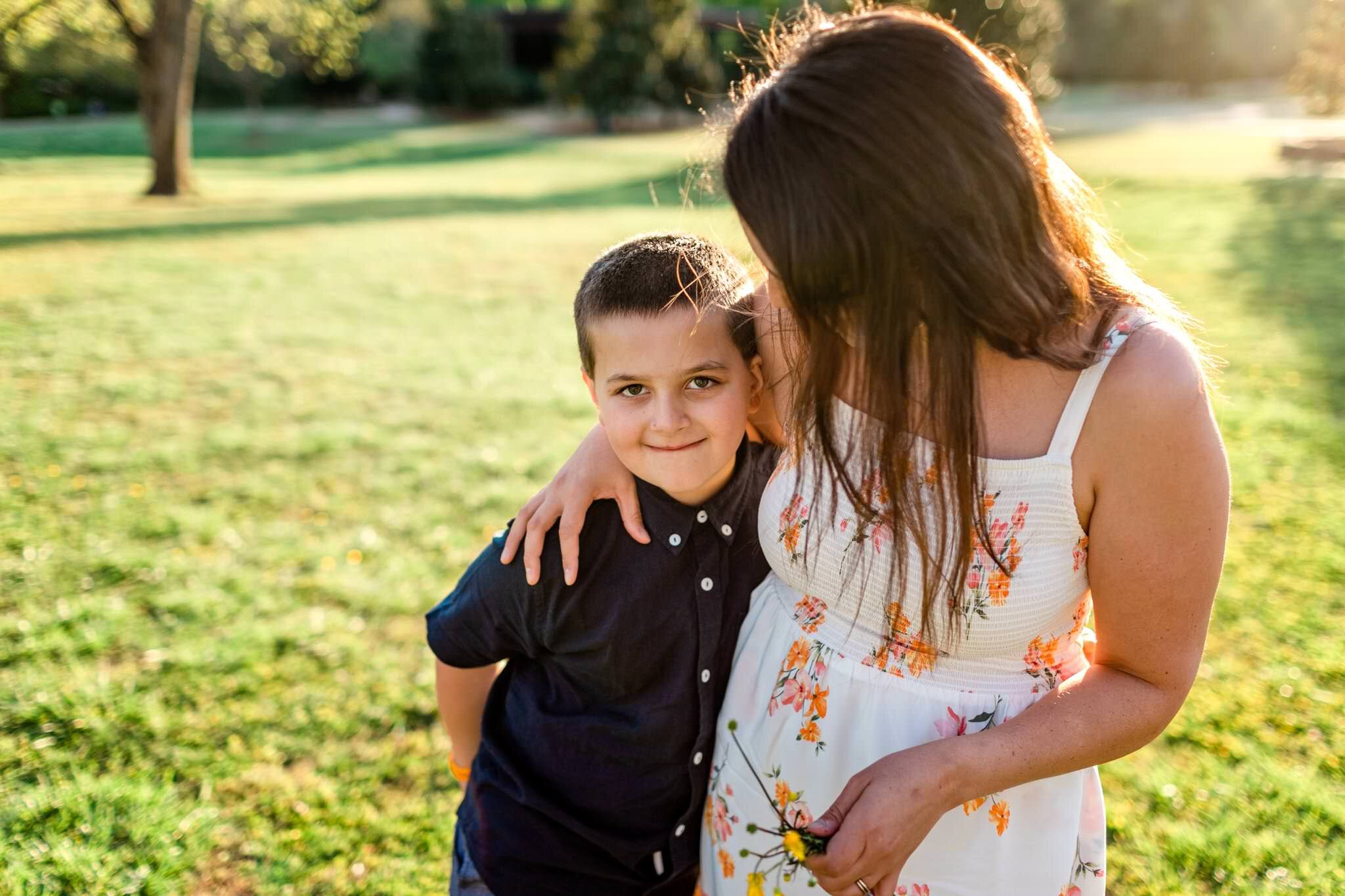 Mother hugging son outside | Raleigh Family Photographer | Joyner Park | By G. Lin Photography