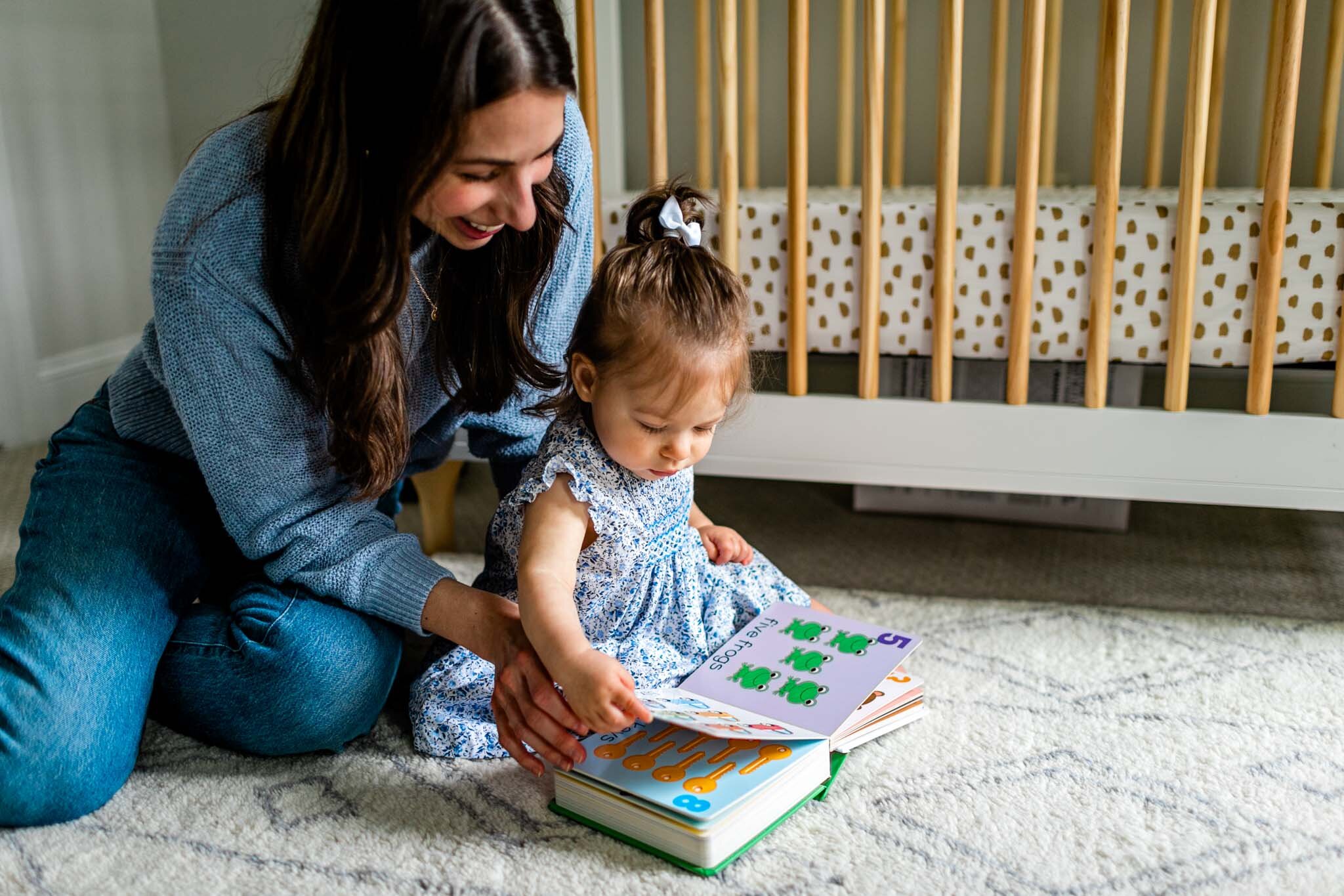 Mother reading to baby girl at home | Durham Family Photographer | By G. Lin Photography 