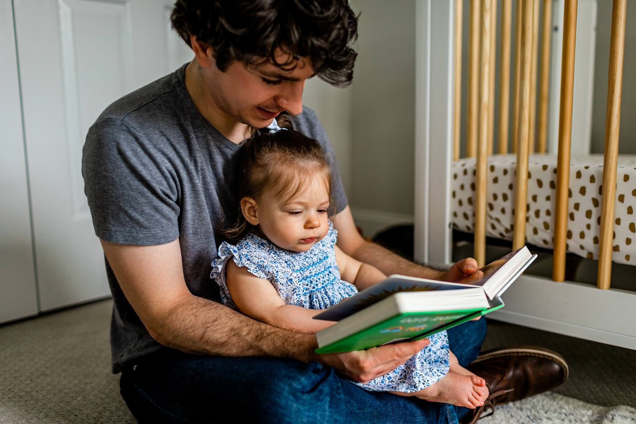 Father reading a book to baby girl | Durham Family Photographer | By G. Lin Photography 