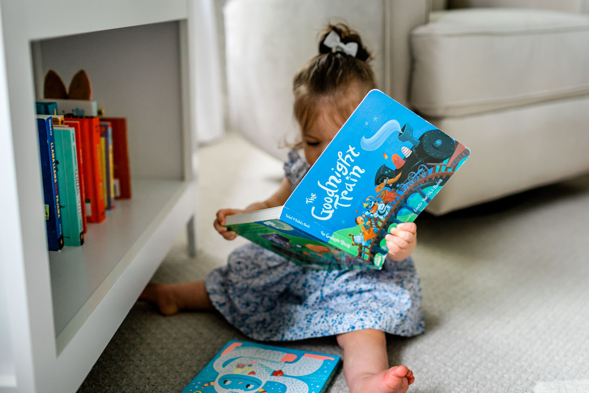 Durham Family Photographer | By G. Lin Photography | Baby girl reading a blue book