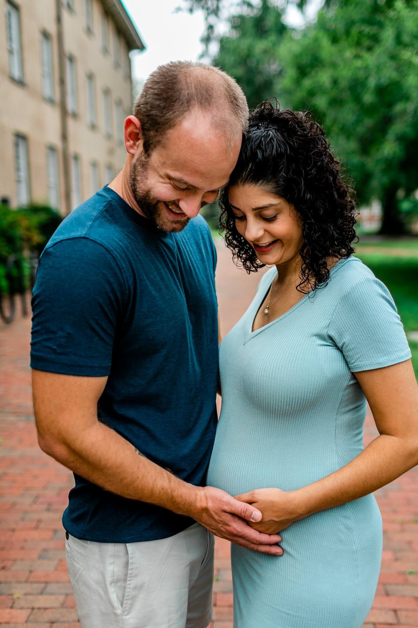 UNC Chapel Hill Maternity Photography | By G. Lin Photography | Couple looking down at baby bump