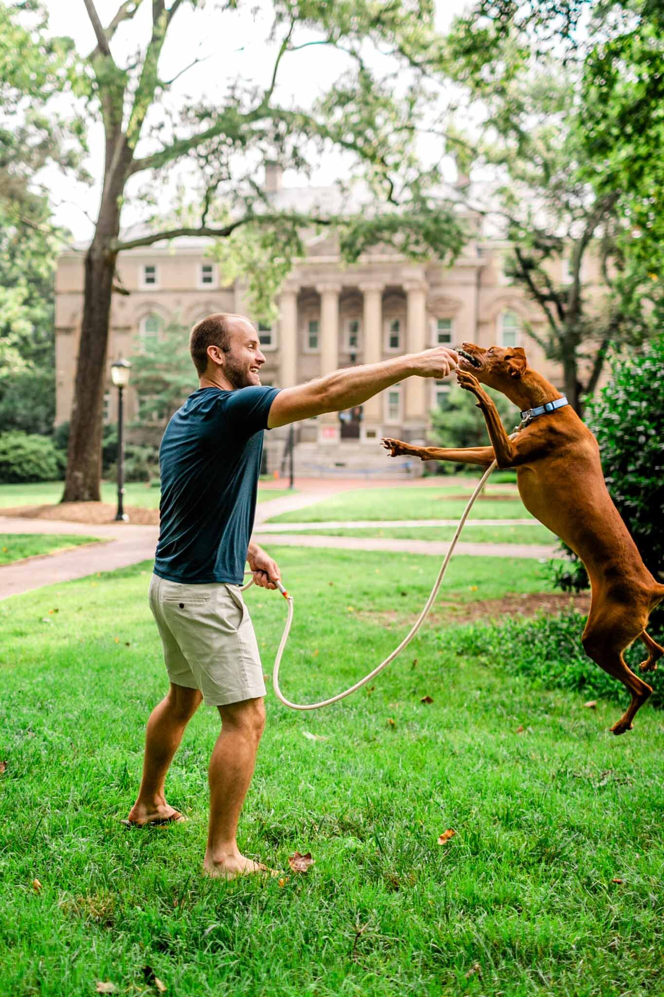 UNC Chapel Hill Maternity Photography | By G. Lin Photography | Dog jumping for stick