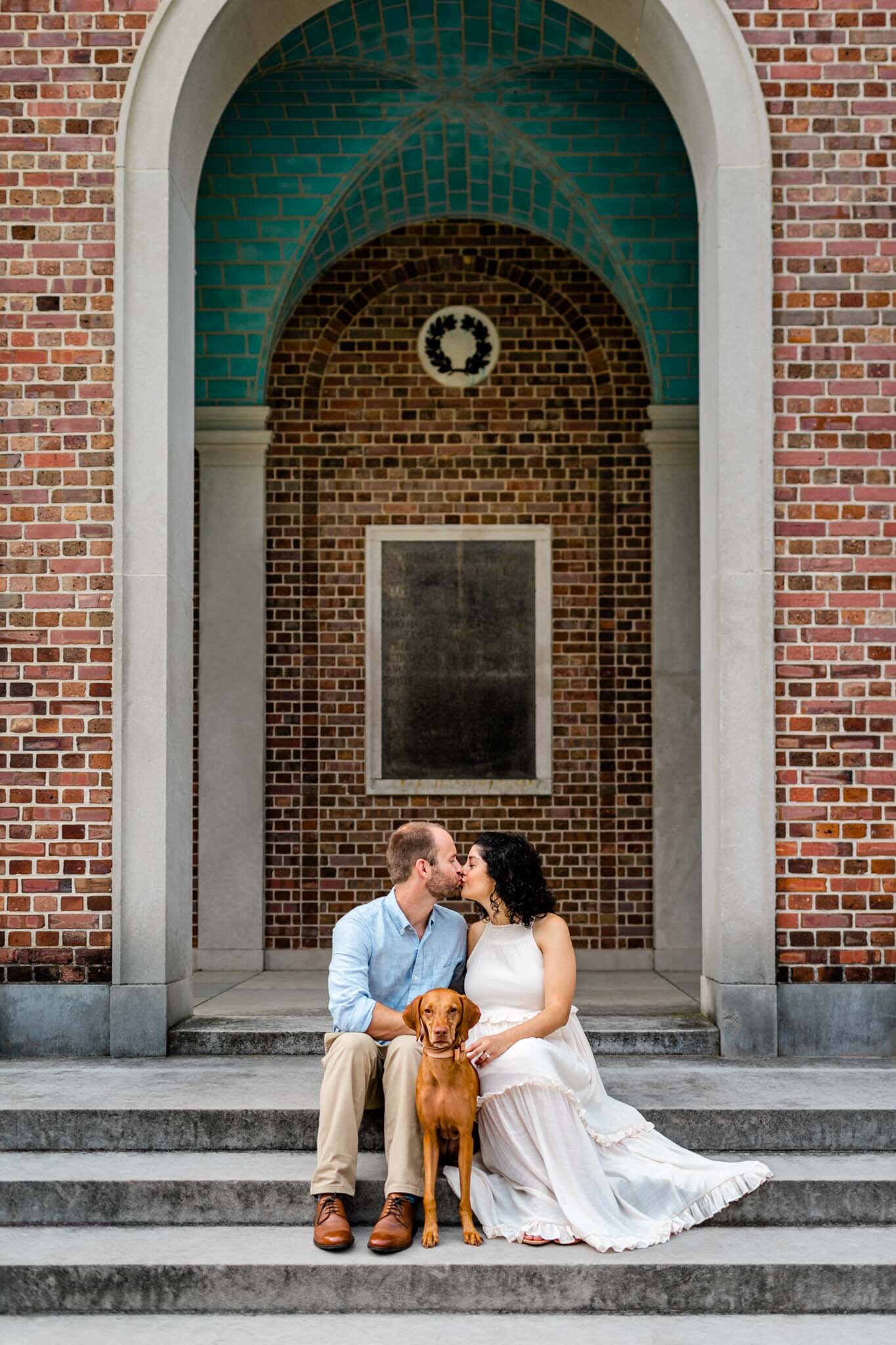 UNC Chapel Hill Maternity Photography | By G. Lin Photography | Couple kissing under the Bell Tower