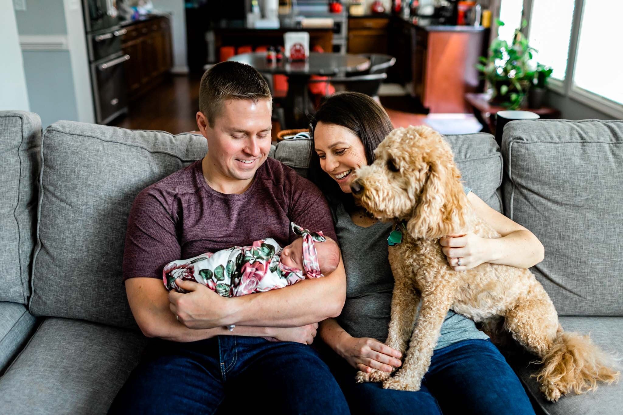 Hillsborough Newborn Photographer | By G. Lin Photography | Family sitting on couch with baby and dog