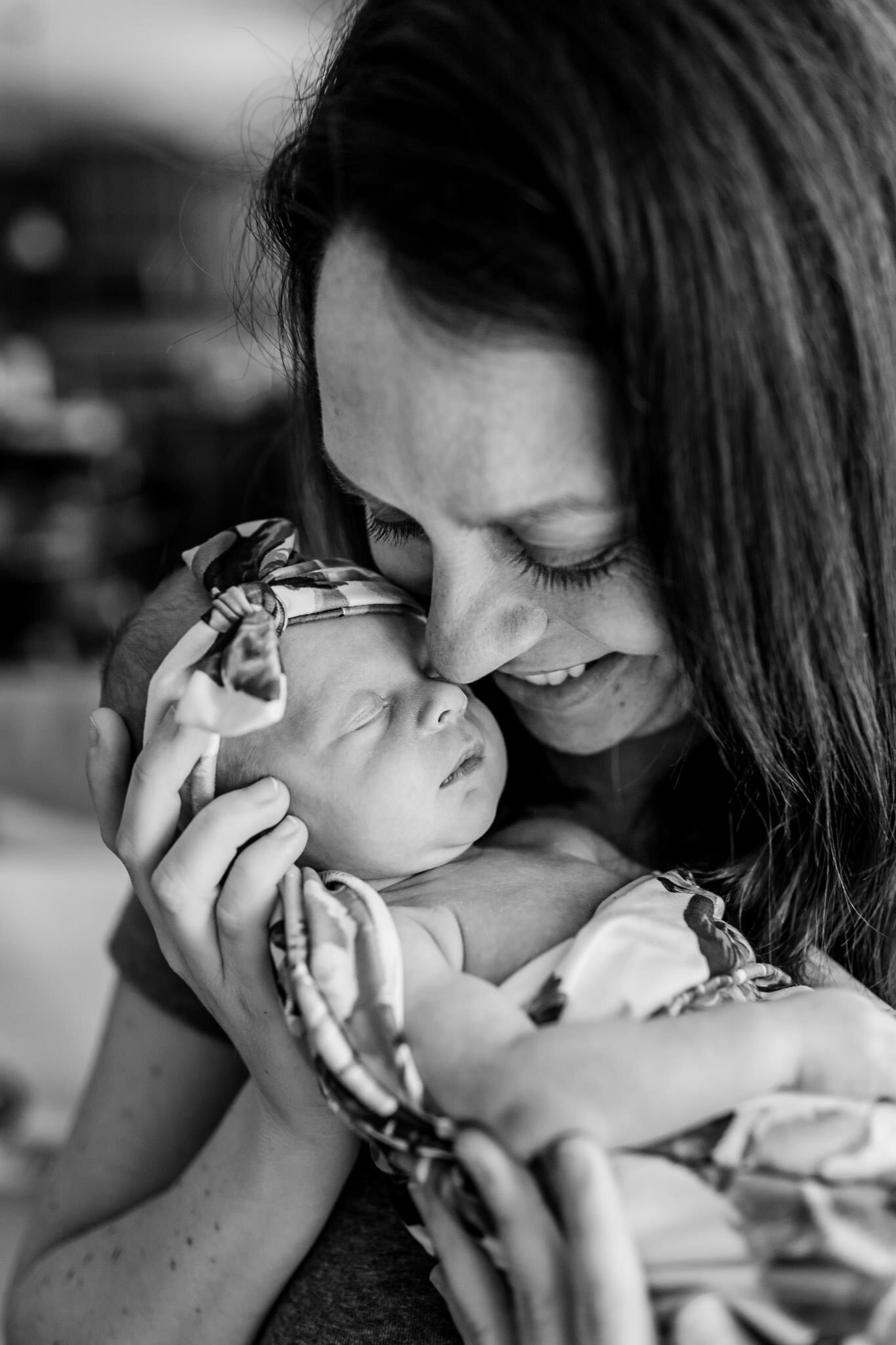 Hillsborough Newborn Photographer | By G. Lin Photography | Black and white photo of mother holding baby girl