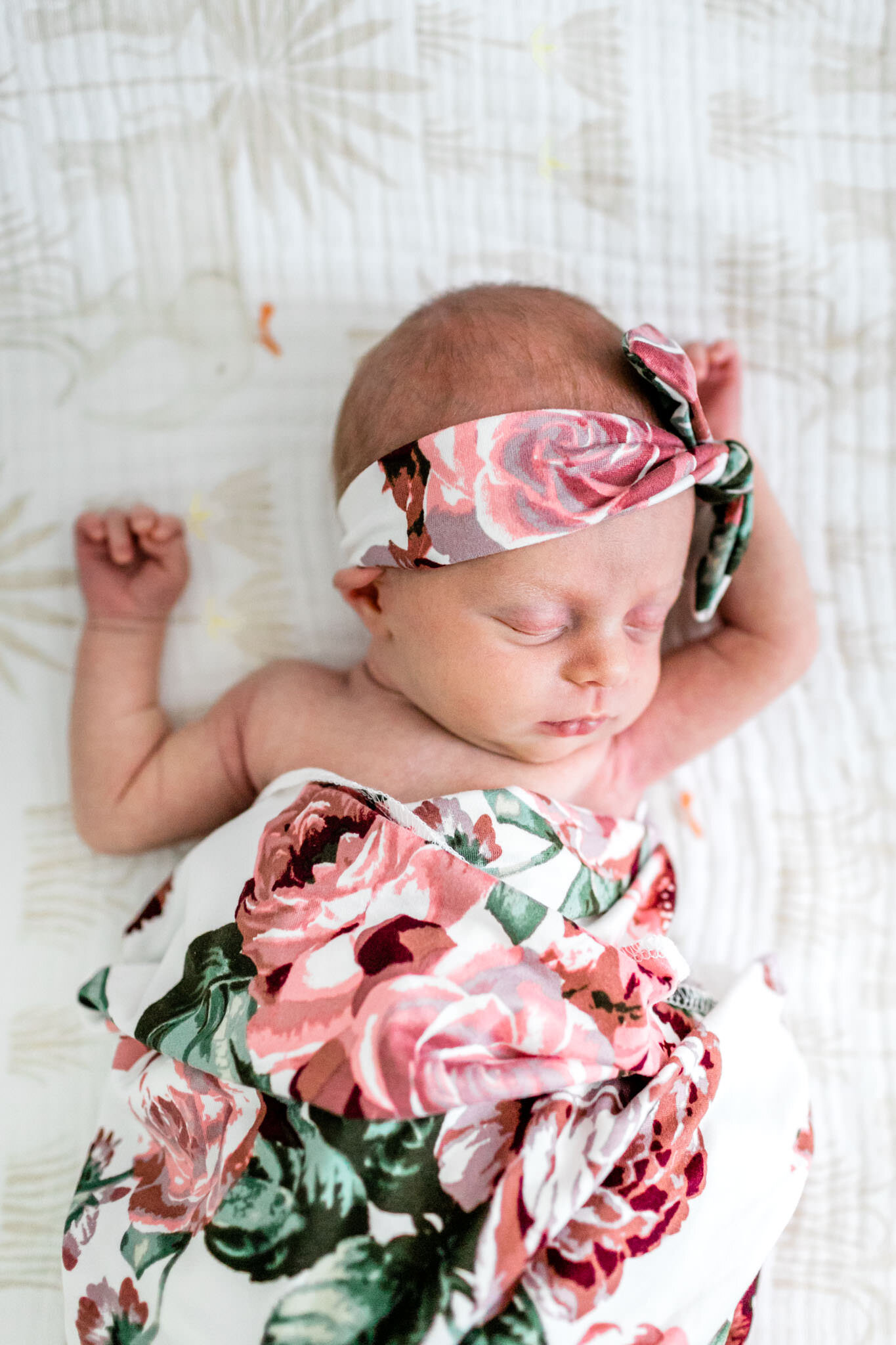 Hillsborough Newborn Photographer | By G. Lin Photography | Baby girl stretching arms in crib