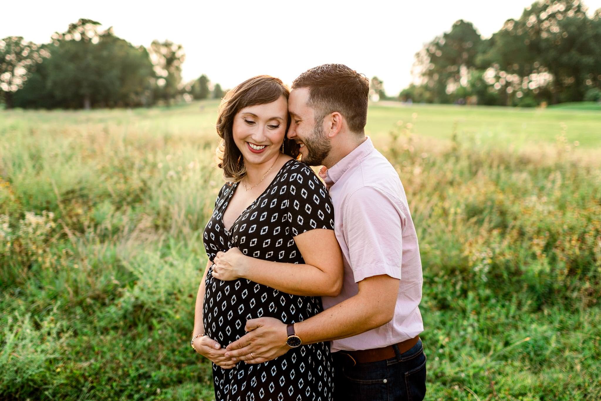 Raleigh Maternity Photographer | By G. Lin Photography | NC Museum of Art | Husband and wife laughing and smiling while standing in open field