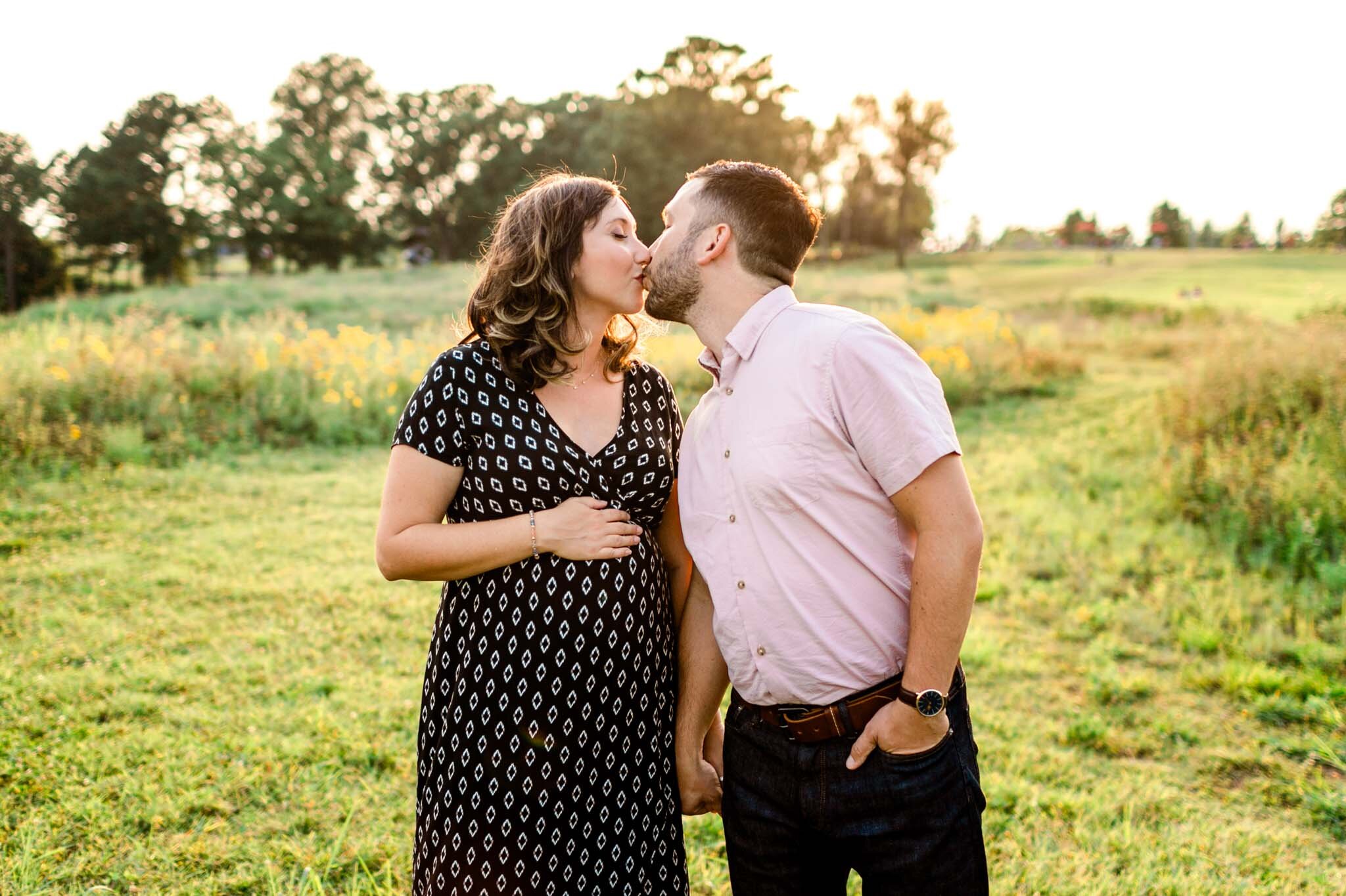 Raleigh Maternity Photographer | By G. Lin Photography | NC Museum of Art | Man and woman kissing in open field