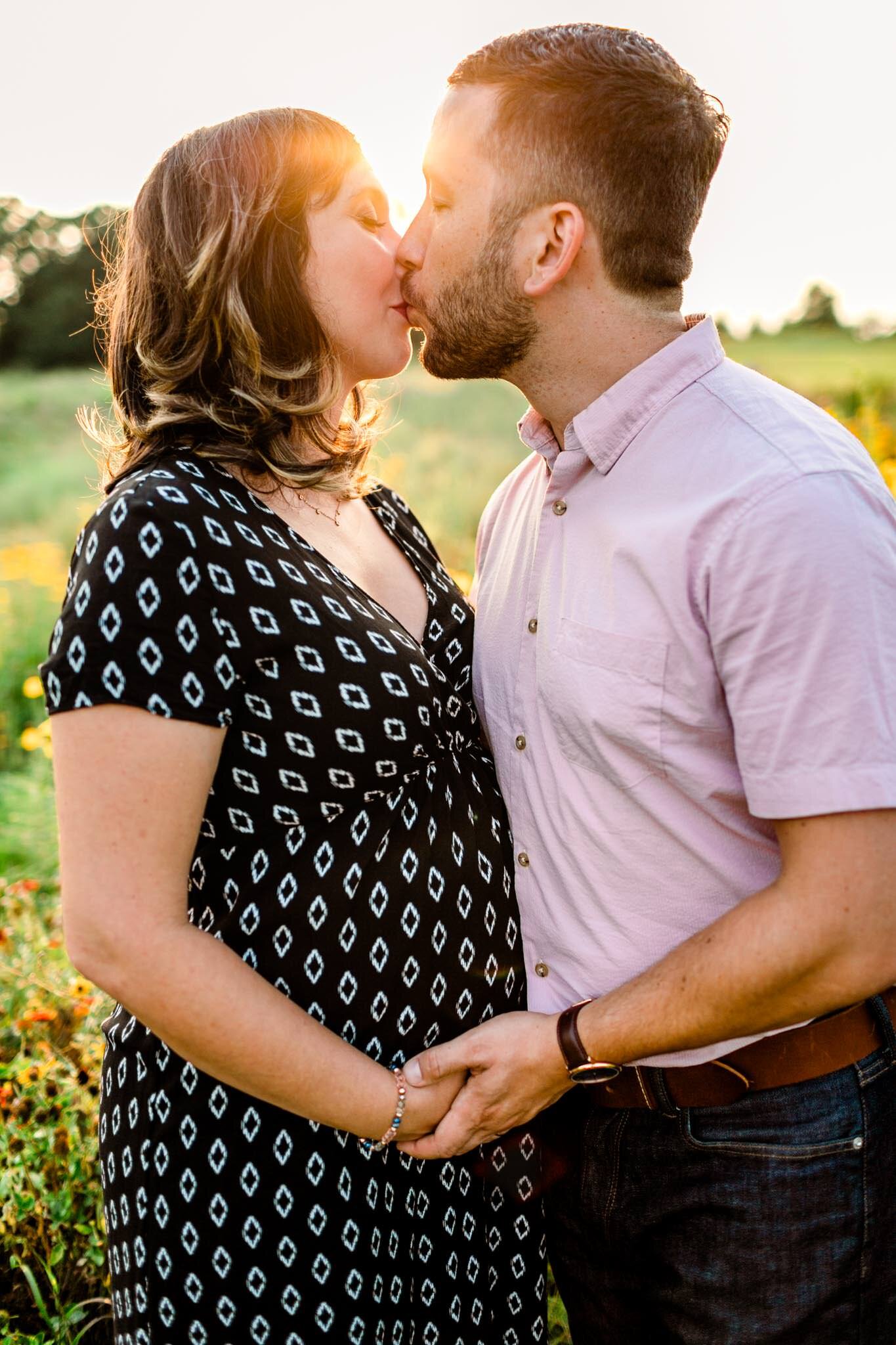 Raleigh Maternity Photographer | By G. Lin Photography | NC Museum of Art | Couple kissing with sunlight behind them