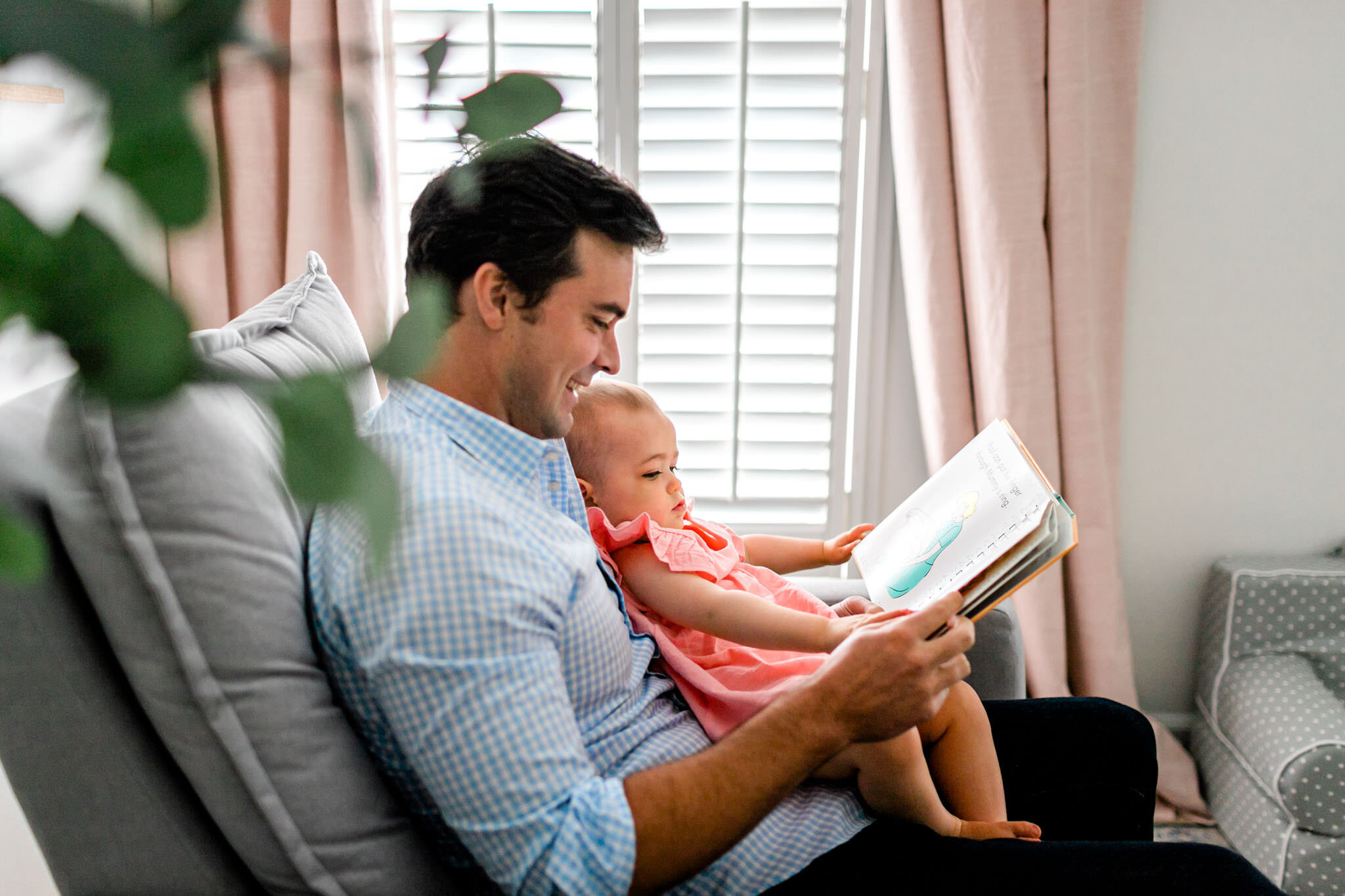 Lifestyle Durham Family Photographer | By G. Lin Photography | Dad reading book to baby girl on chair