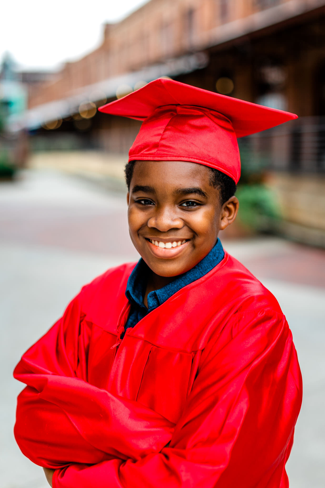 Durham Family Photographer | By G. Lin Photography | Graduation portrait of young boy in red gown