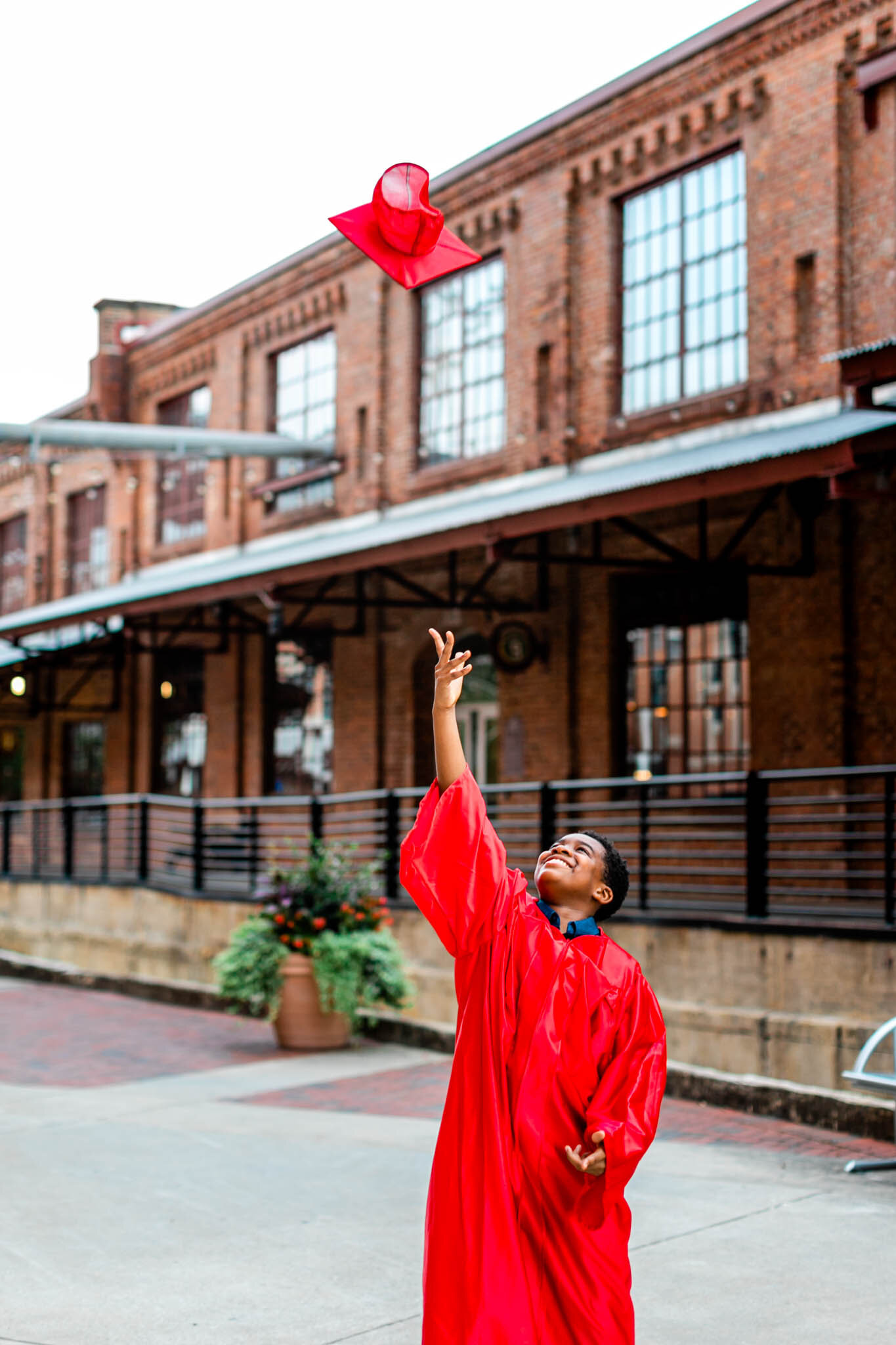 Durham Family Photographer | By G. Lin Photography | Boy tossing up graduation cap