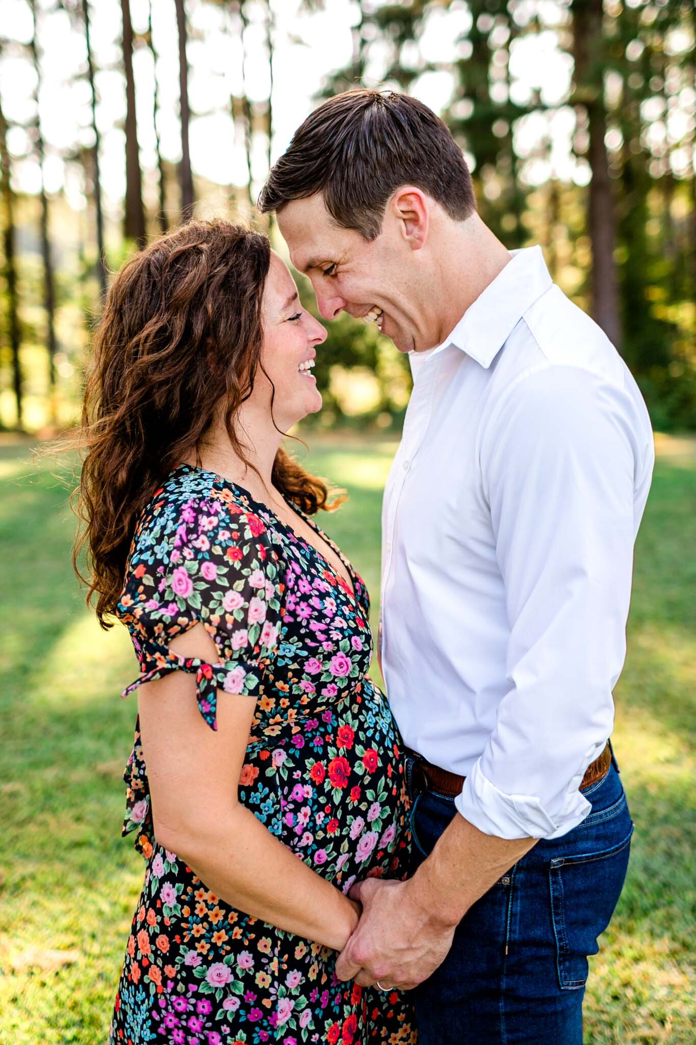 Raleigh Maternity Photographer | Dix Park | By G. Lin Photography | Couple laughing and holding hands