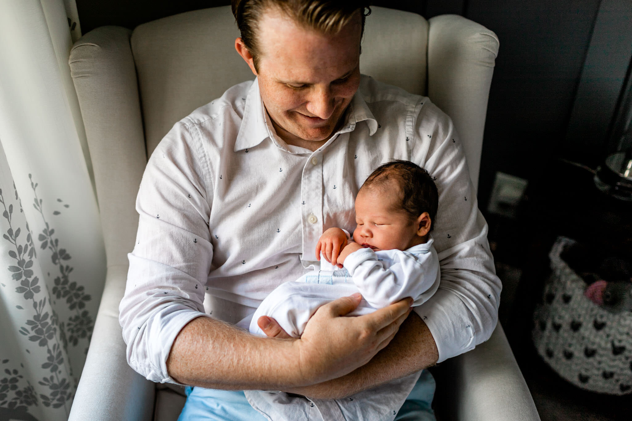 Pittsboro Newborn Photographer | By G. Lin Photography | Father holding baby boy in his arms