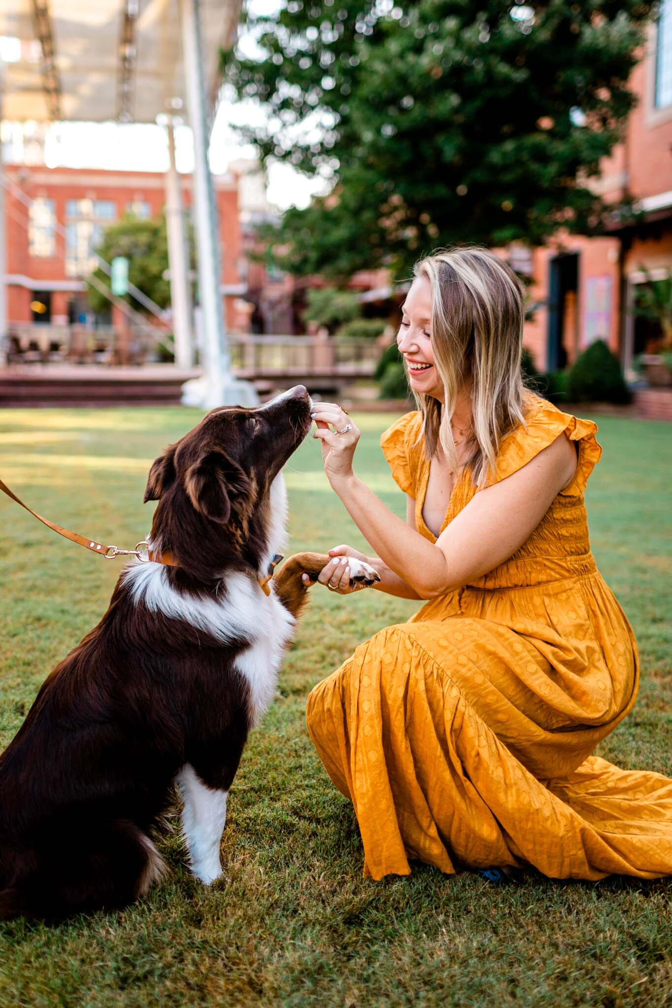 Durham Family Photographer | By G. Lin Photography | Woman feeding dog treat