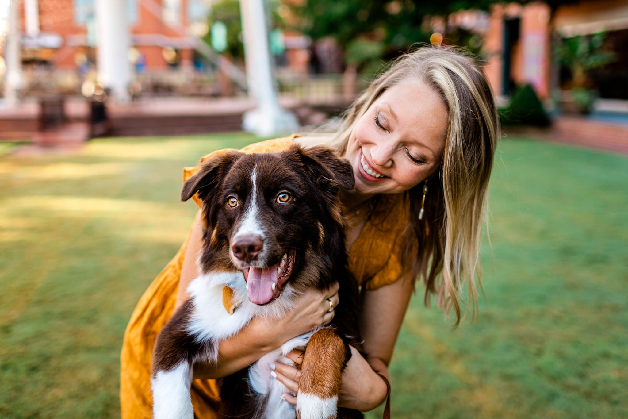 Durham Family Photographer | By G. Lin Photography | Woman holding dog and laughing