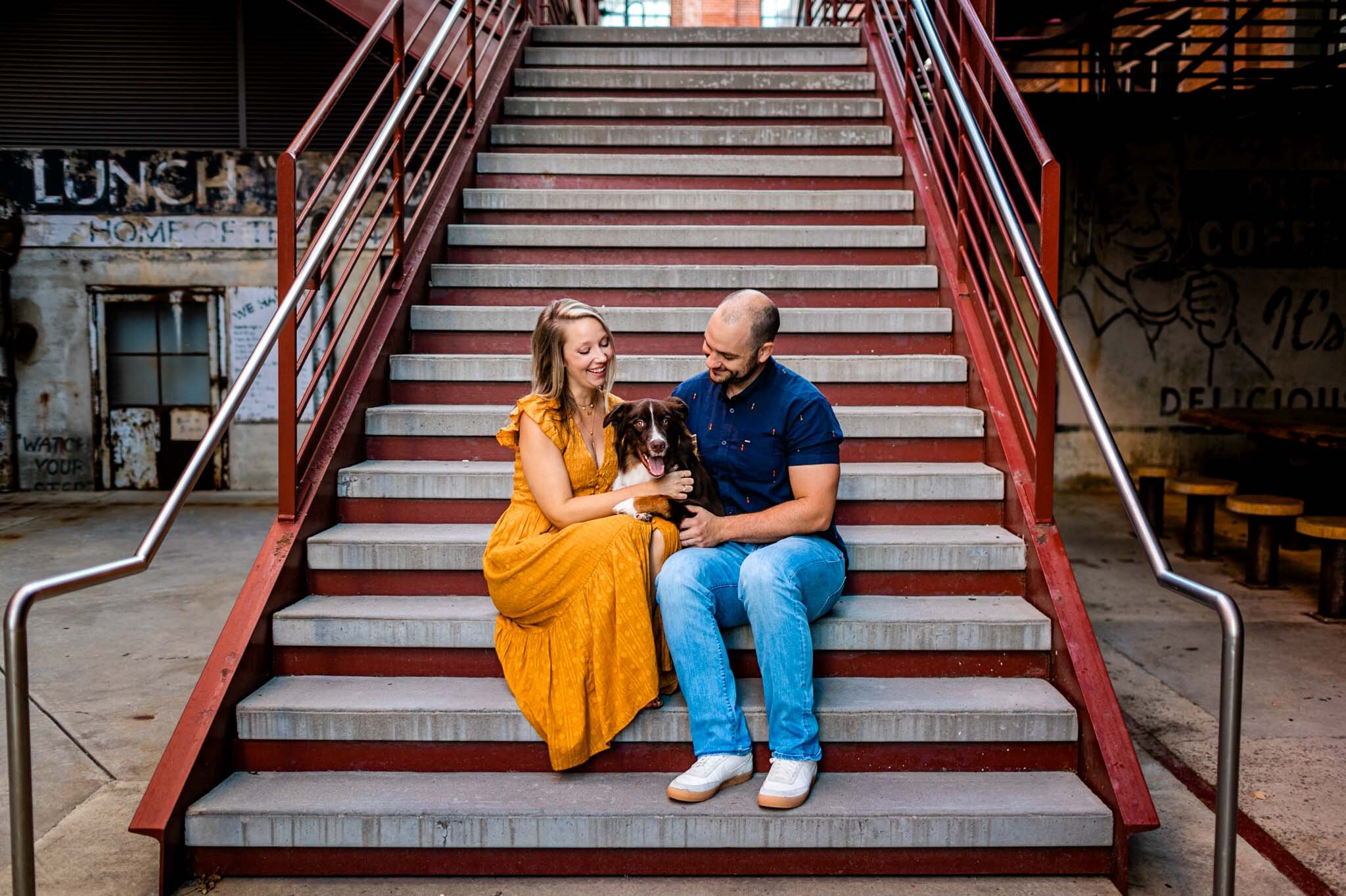 Durham Family Photographer | By G. Lin Photography | Man and woman sitting on stairs with dog outside