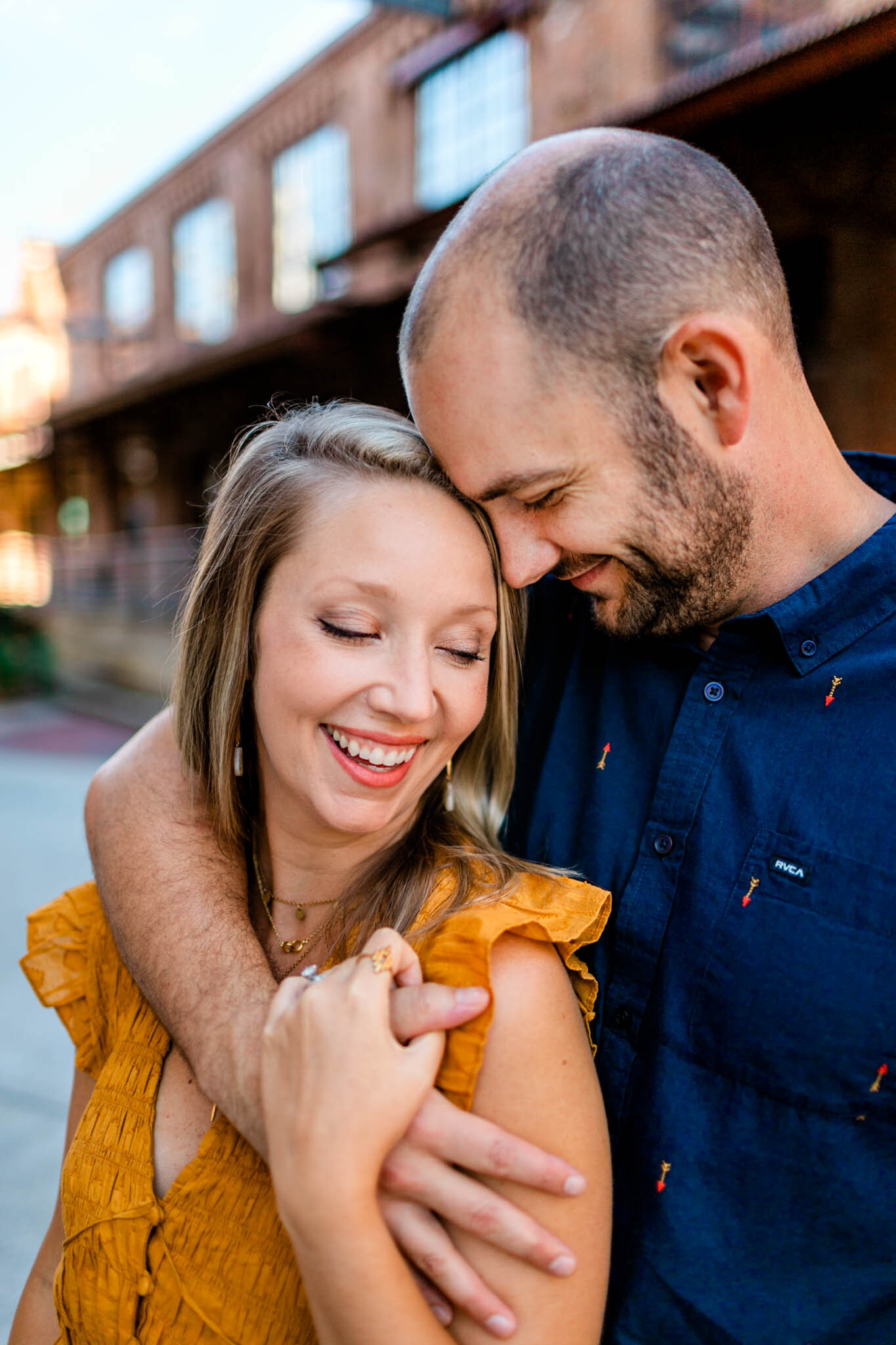 Durham Family Photographer | By G. Lin Photography | Man and woman embracing one another and smiling