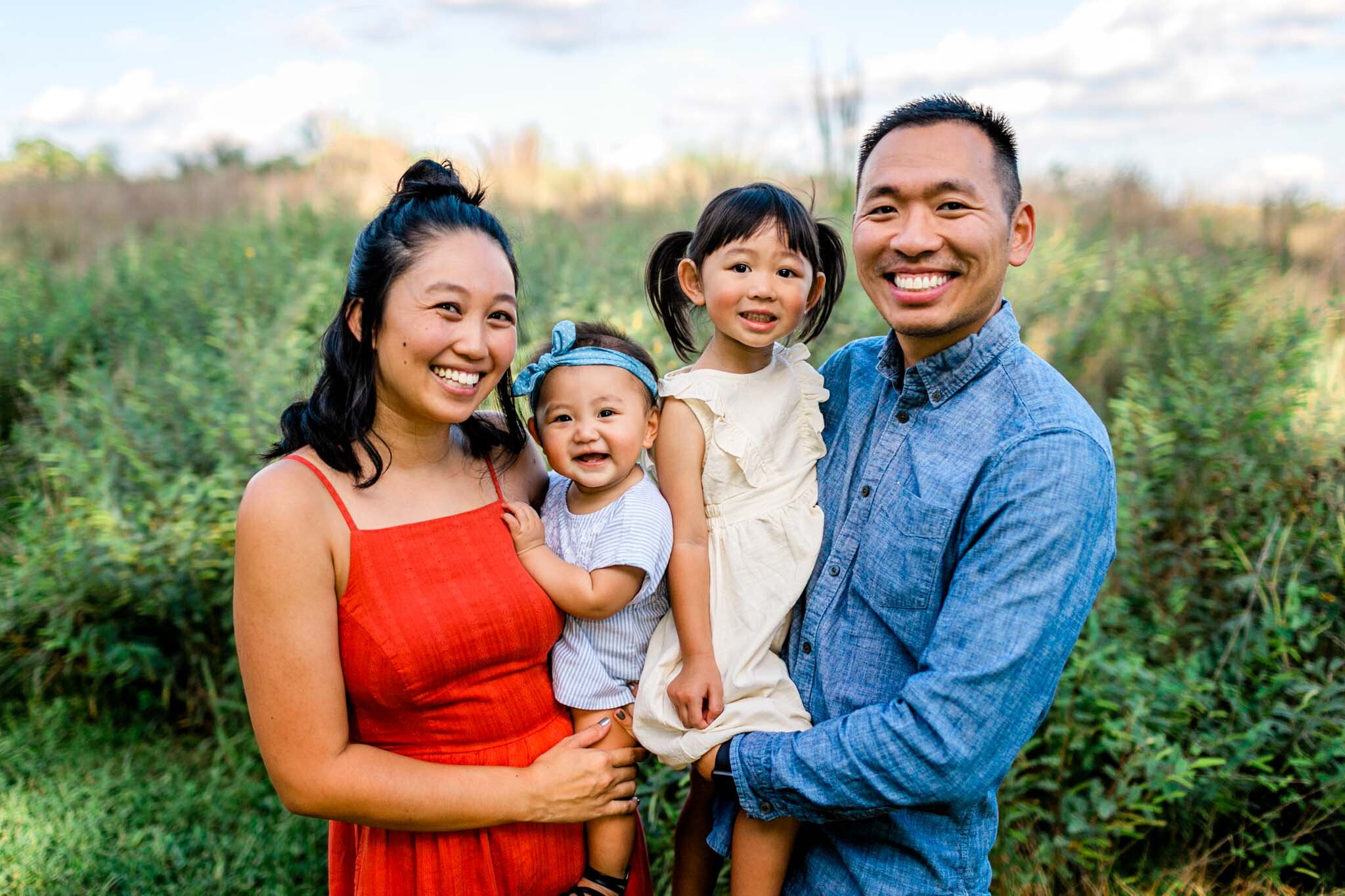 Raleigh Family Photographer | By G. Lin Photography | Beautiful portrait of family smiling at camera at NCMA