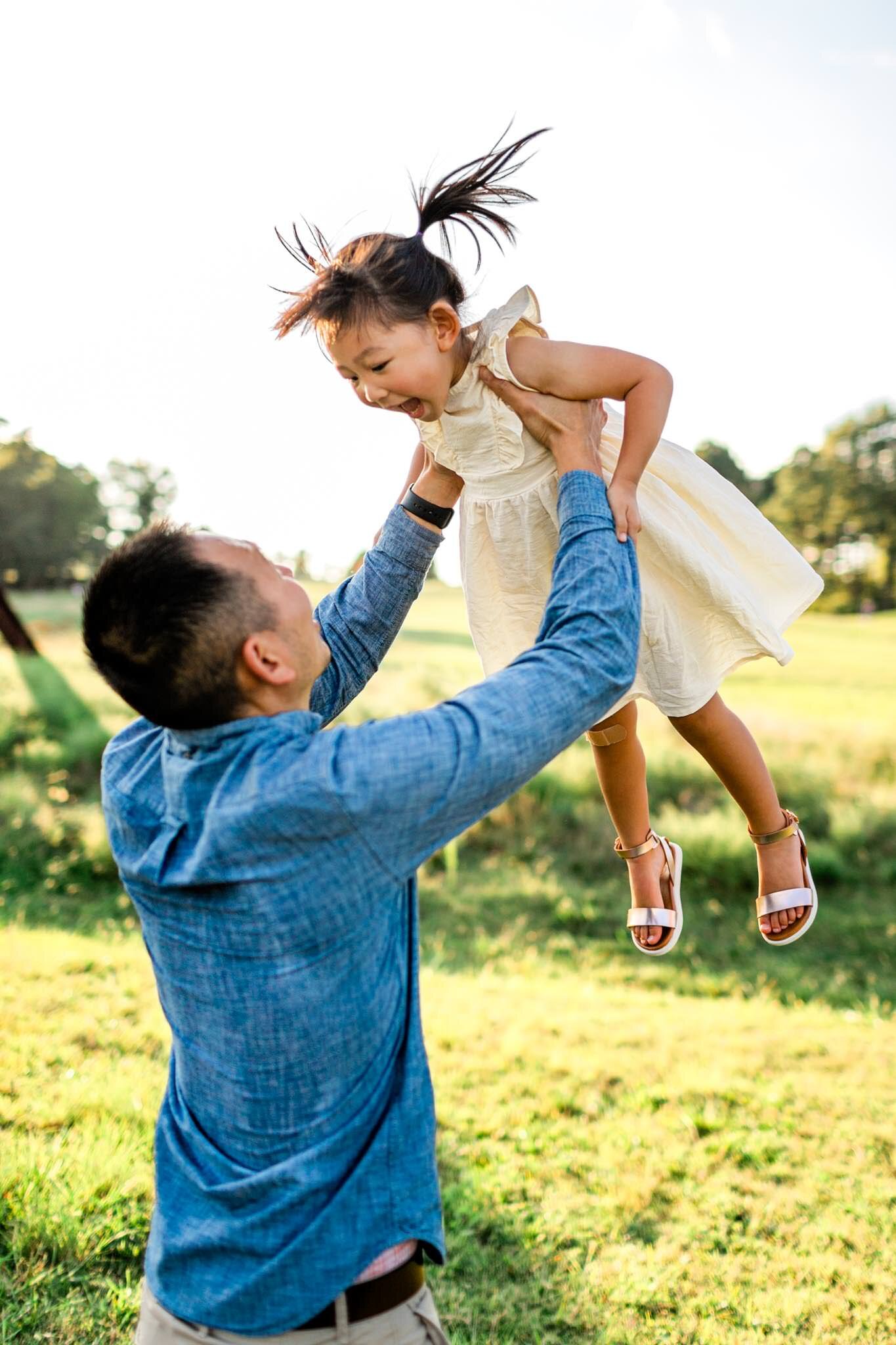 Raleigh Family Photographer | By G. Lin Photography | Father throwing daughter in the air