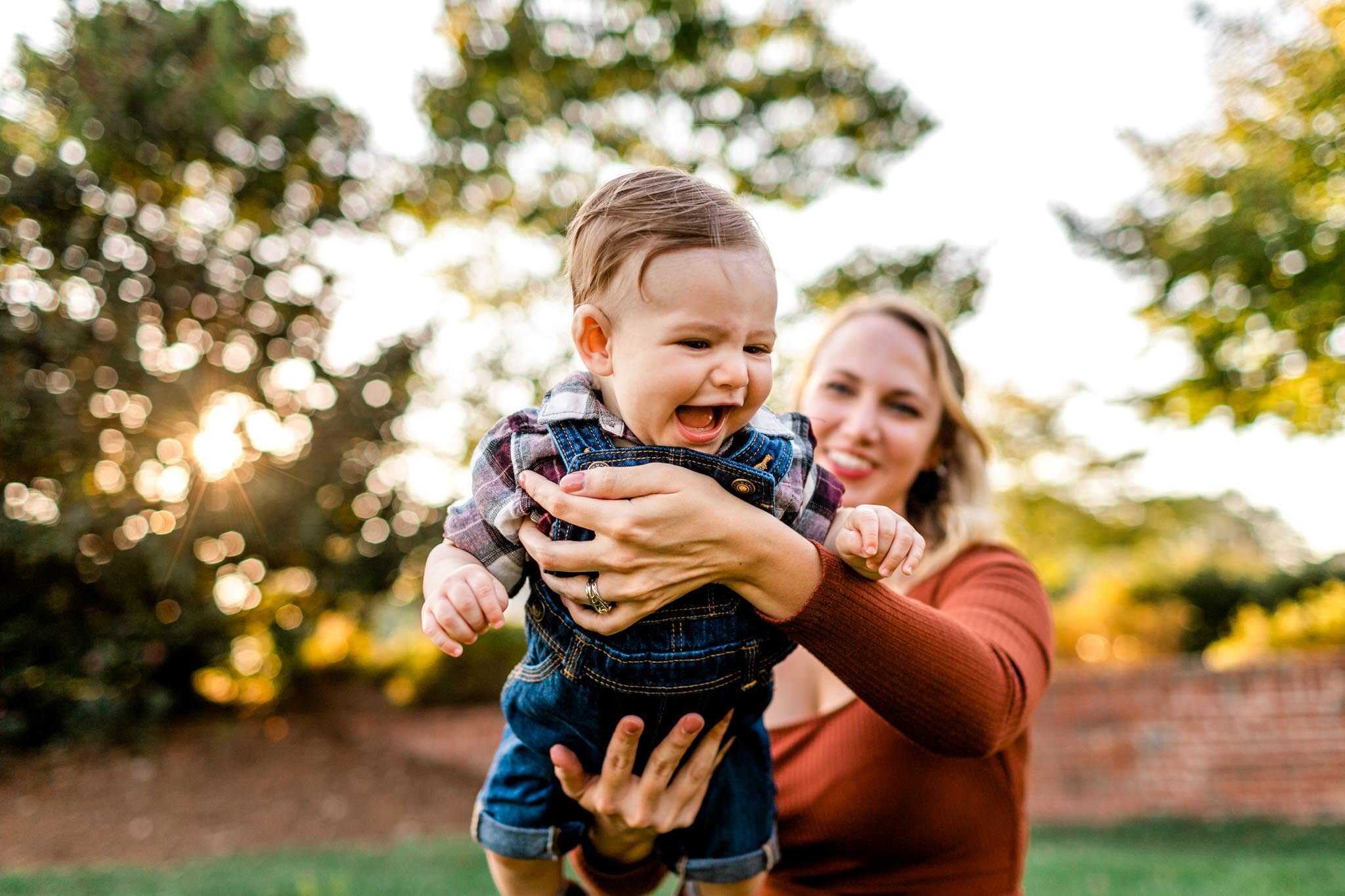Durham Family Photographer | By G. Lin Photography | Mother swinging baby boy and both are laughing