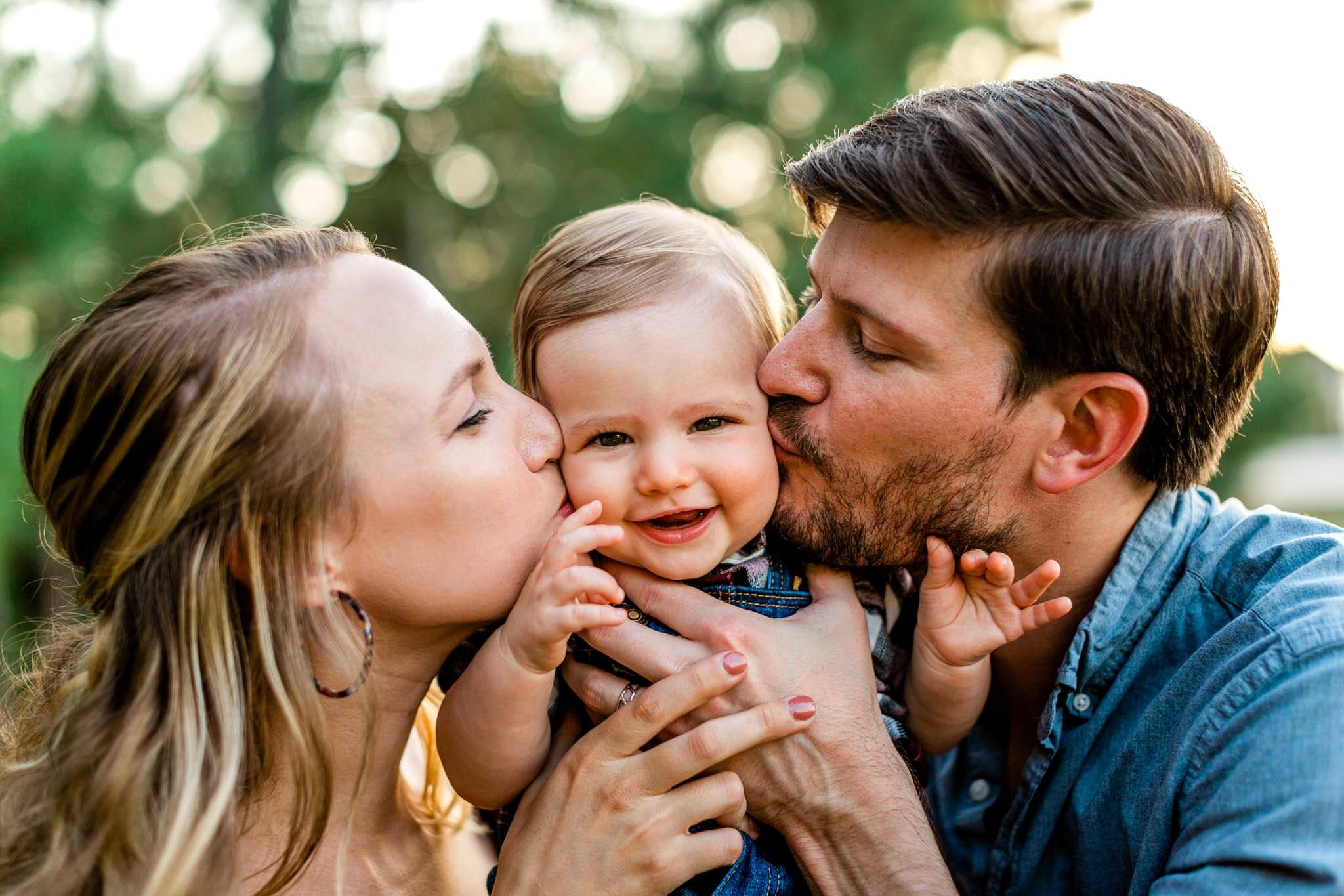 Durham Family Photographer | By G. Lin Photography | Mother and father kissing baby's cheeks
