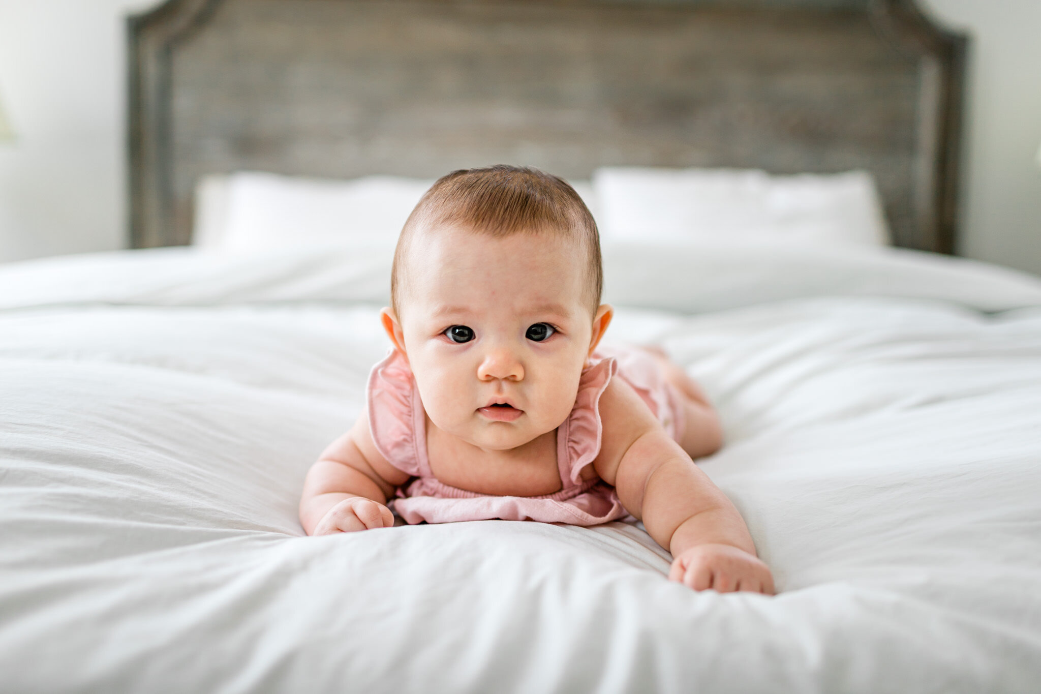 Raleigh Family Photographer | By G. Lin Photography | Baby girl tummy time on bed