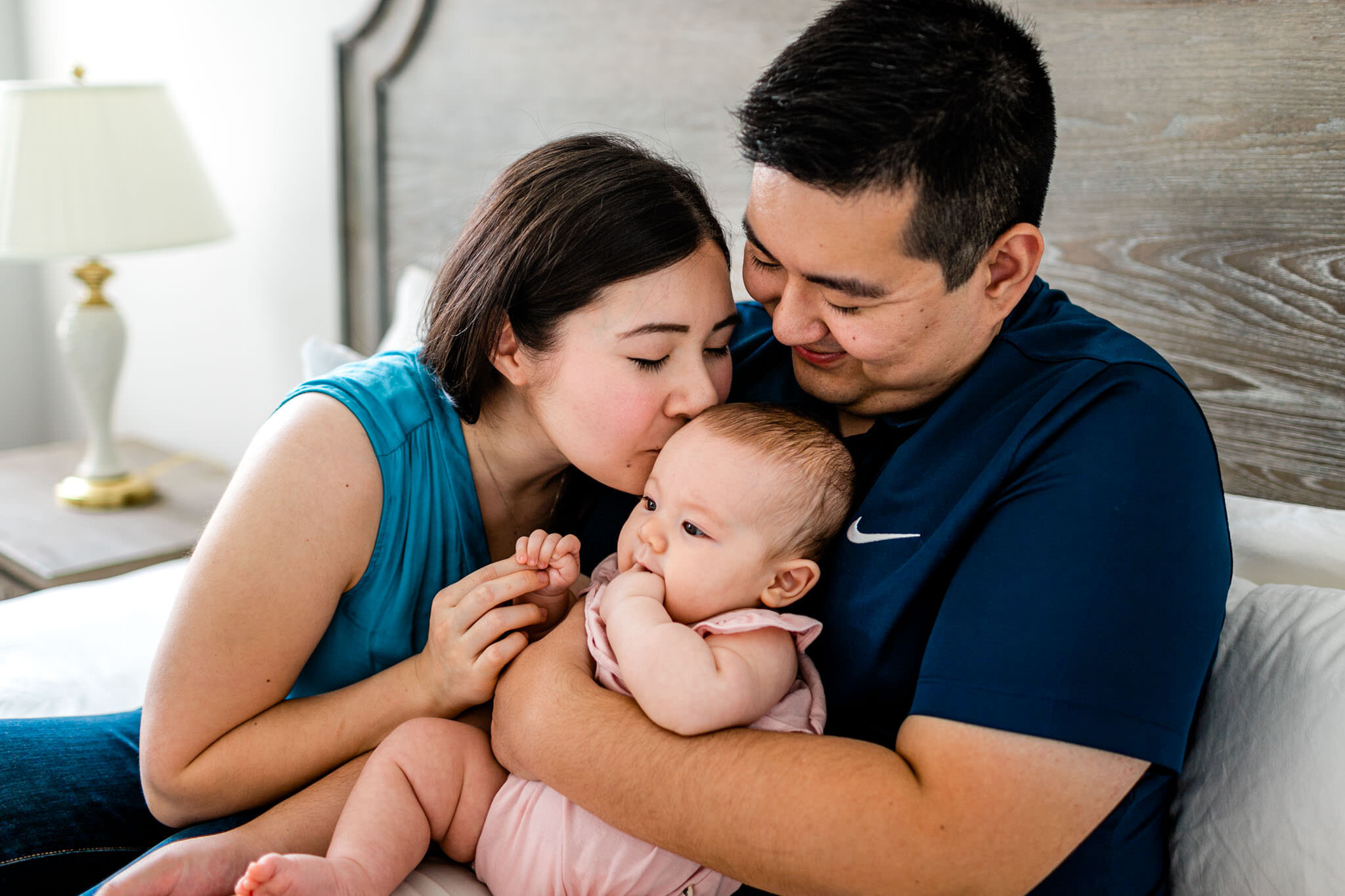 Raleigh Family Photographer | By G. Lin Photography | Mom kissing daughter