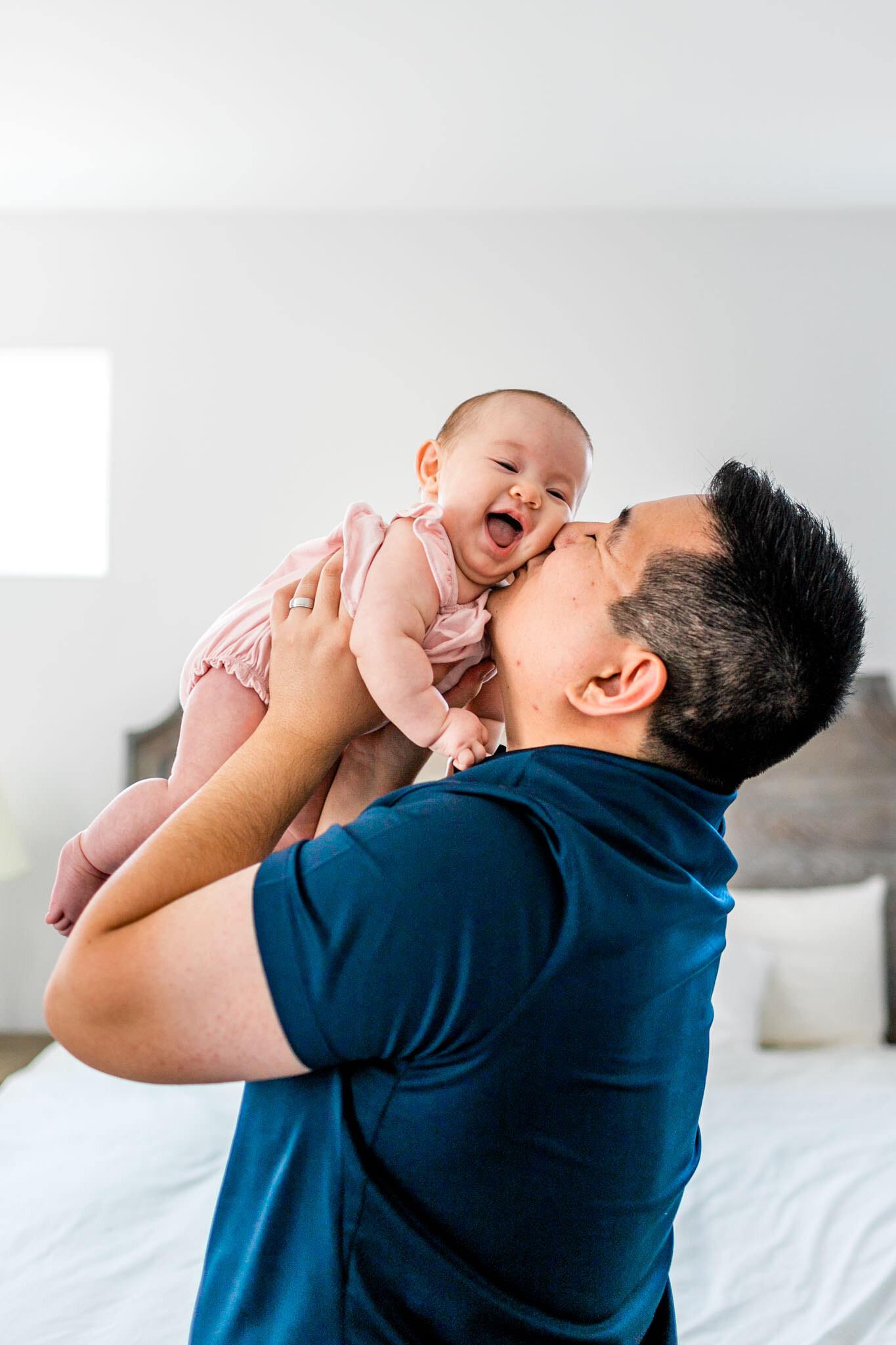 Raleigh Family Photographer | By G. Lin Photography | Dad kissing baby girl